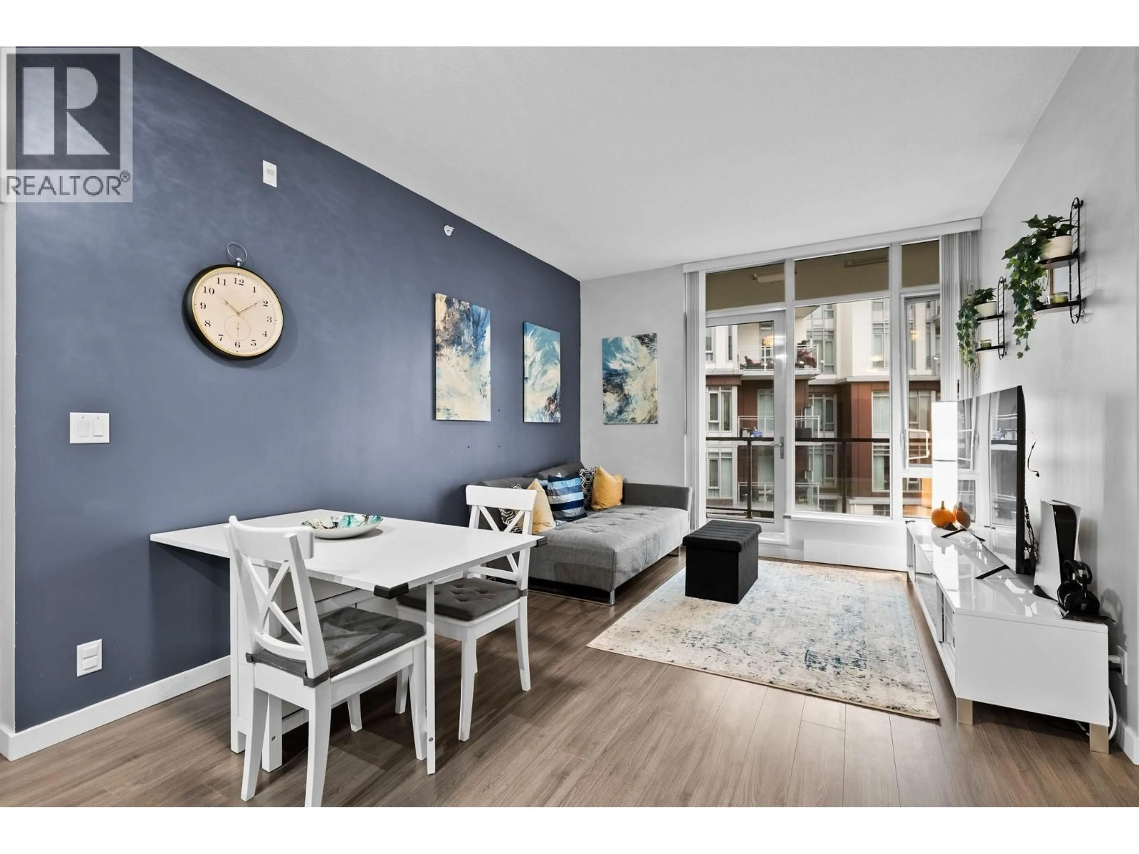 Living room with furniture, wood/laminate floor for 503 - 3168 RIVERWALK AVENUE, Vancouver British Columbia V5S0B8