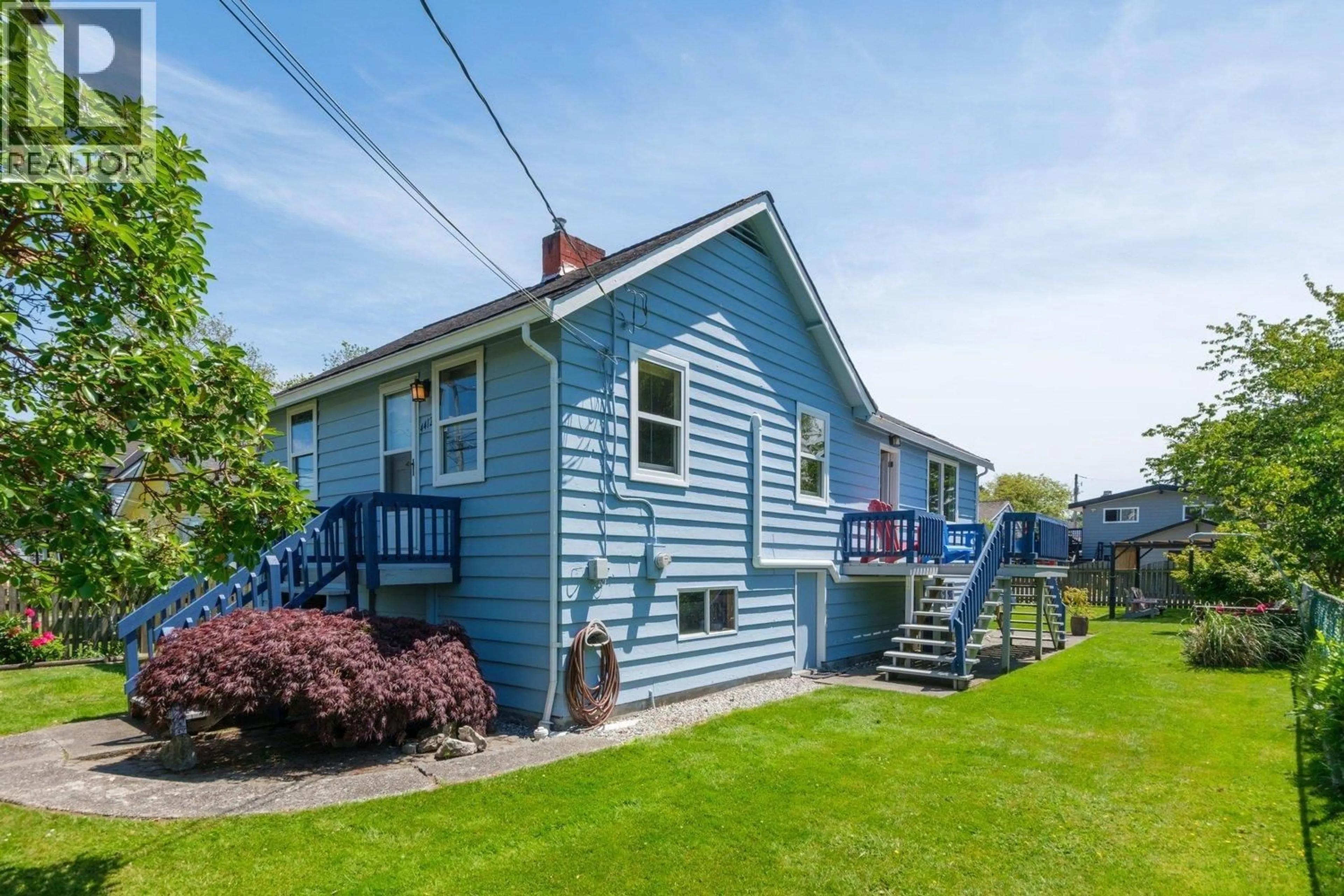 Home with vinyl exterior material, street for 4412 RIVER ROAD, Delta British Columbia V4K1S2