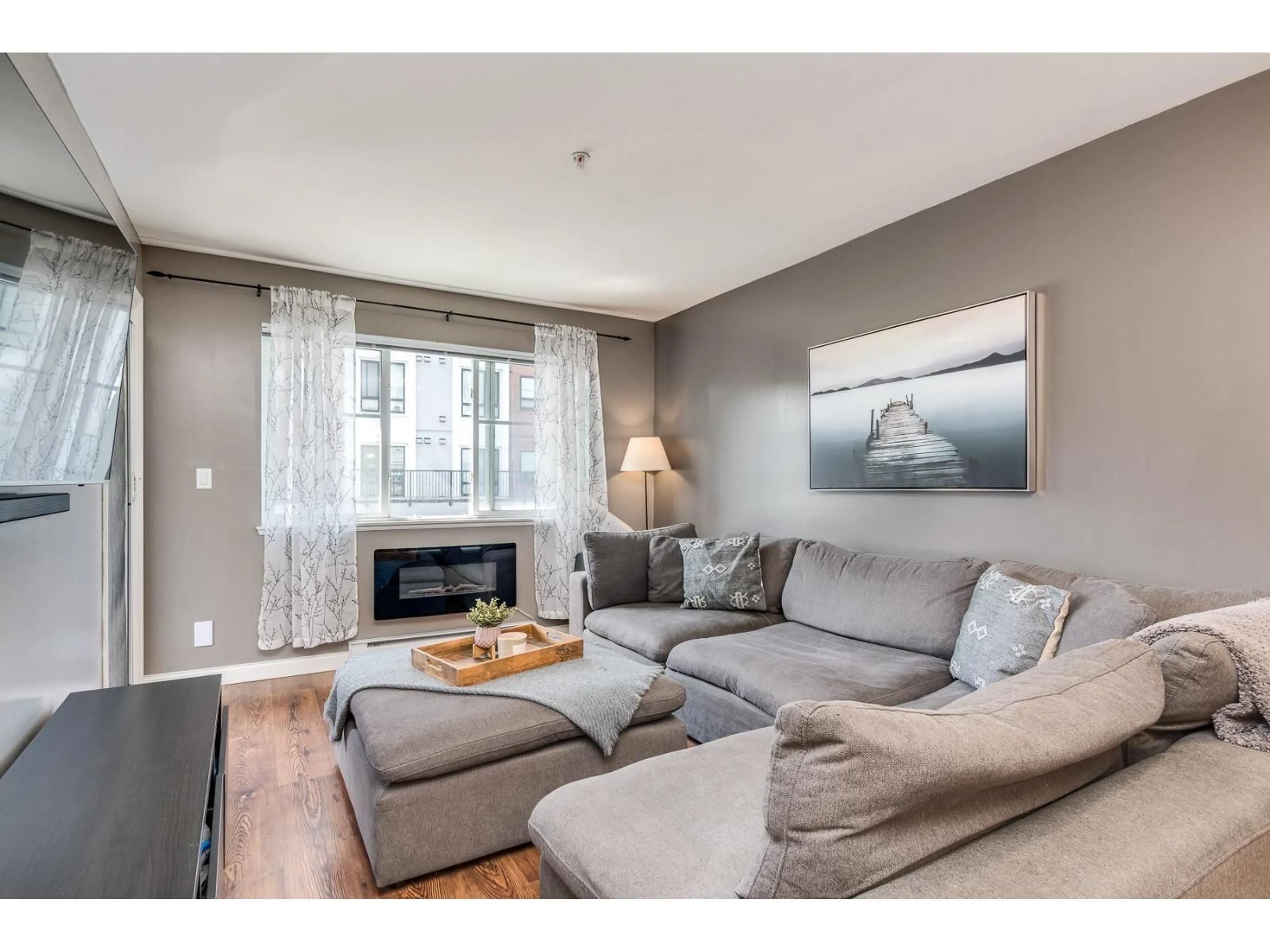 Living room with furniture, wood/laminate floor for 114 - 5438 198 STREET, Langley British Columbia V3A1G2