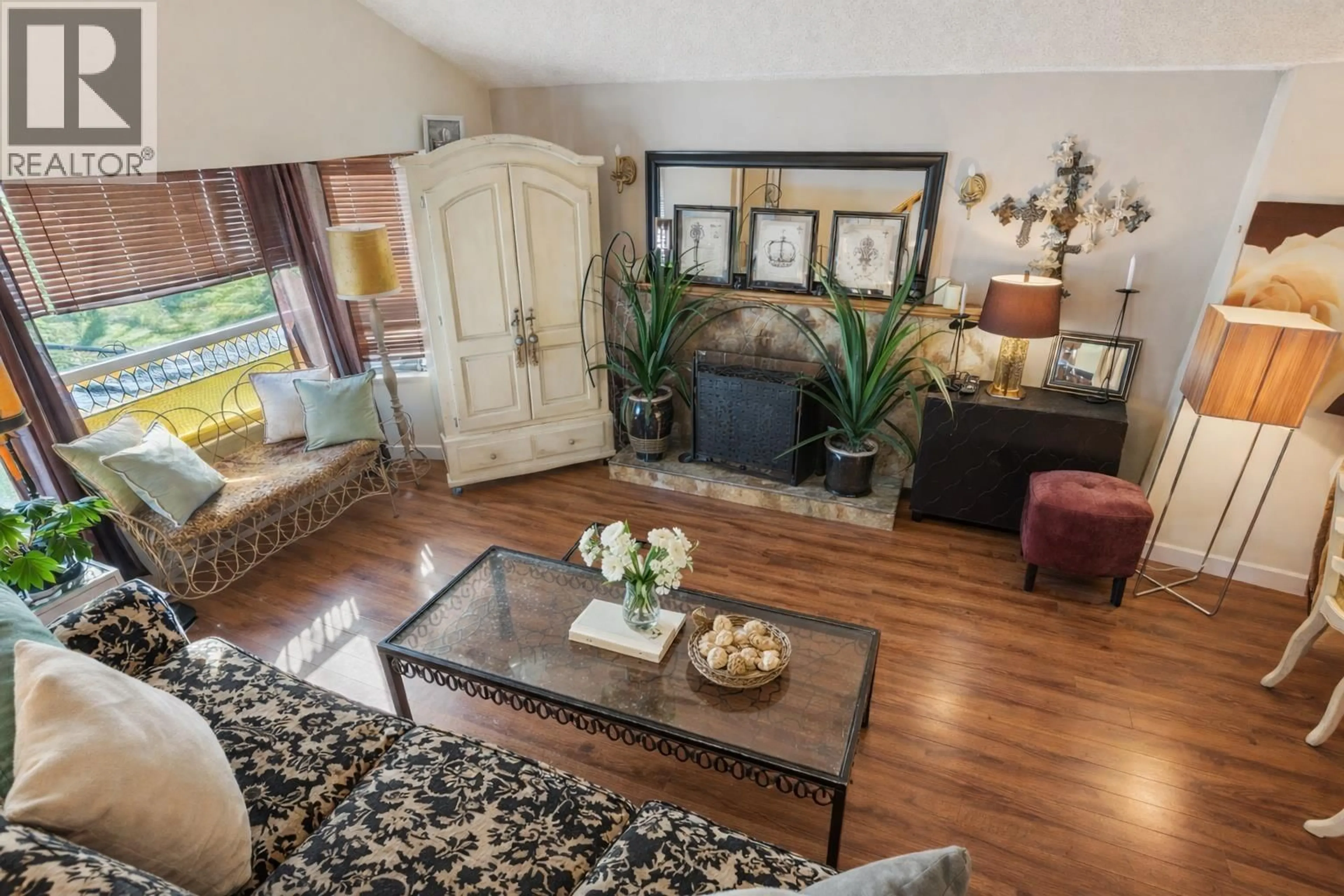 Living room with furniture, wood/laminate floor for 875 PORTEAU PLACE, North Vancouver British Columbia V7H2P8