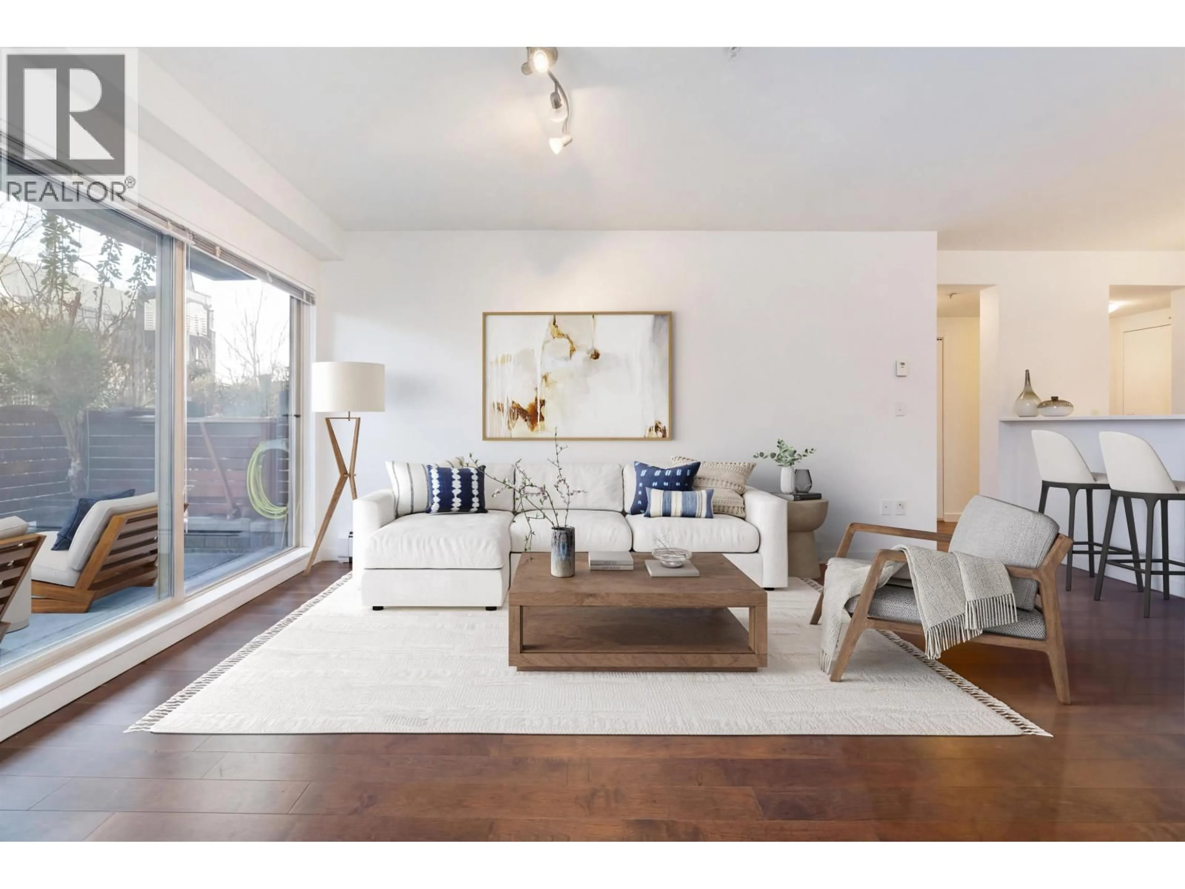 Living room with furniture, wood/laminate floor for 109 - 1033 ST. GEORGES AVENUE, North Vancouver British Columbia V7L3H5