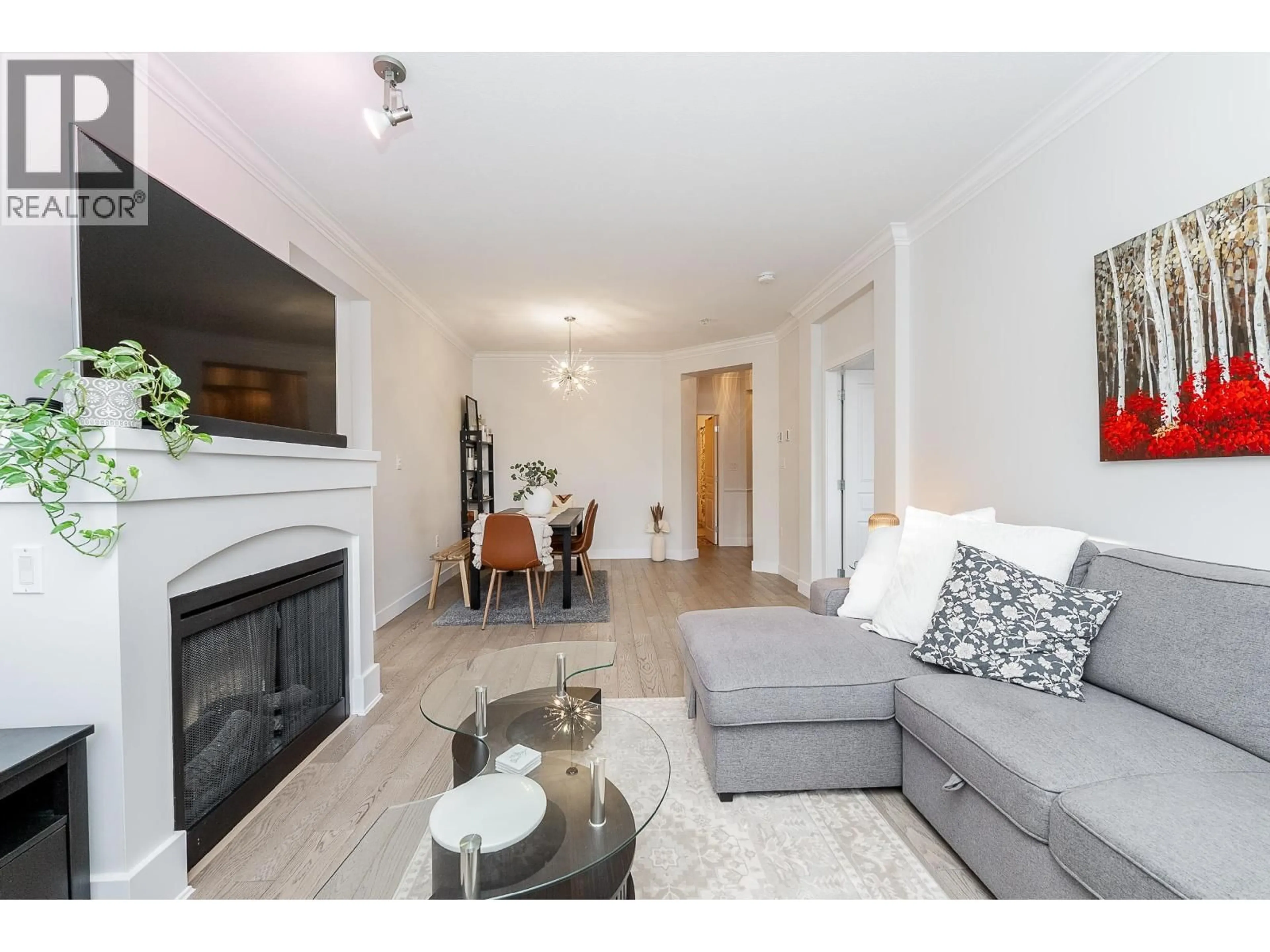 Living room with furniture, wood/laminate floor for 208 - 2969 WHISPER WAY, Coquitlam British Columbia V3E3S8