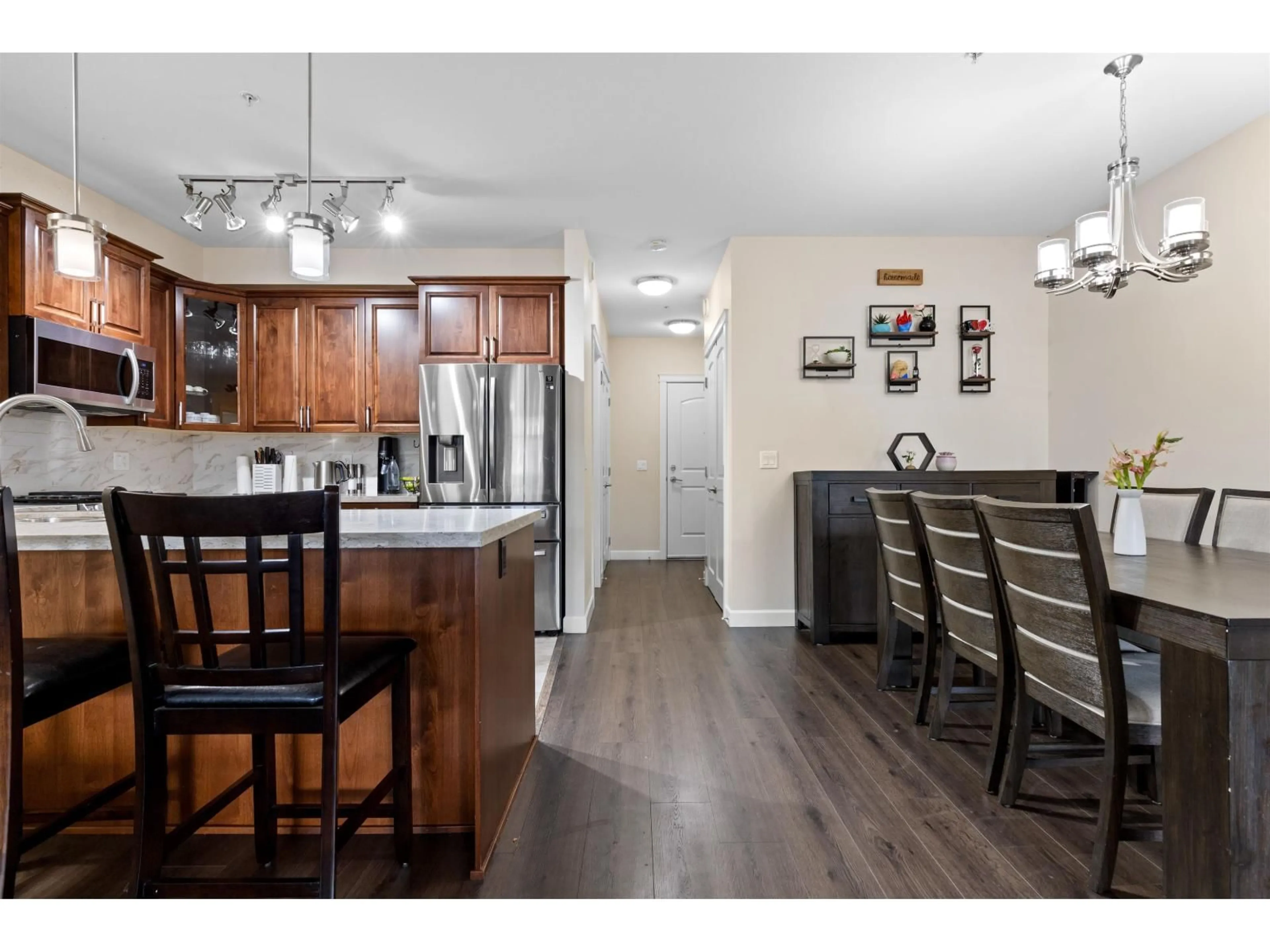 Open concept kitchen, wood/laminate floor for 408 - 8561 203A STREET, Langley British Columbia V2Y3L7