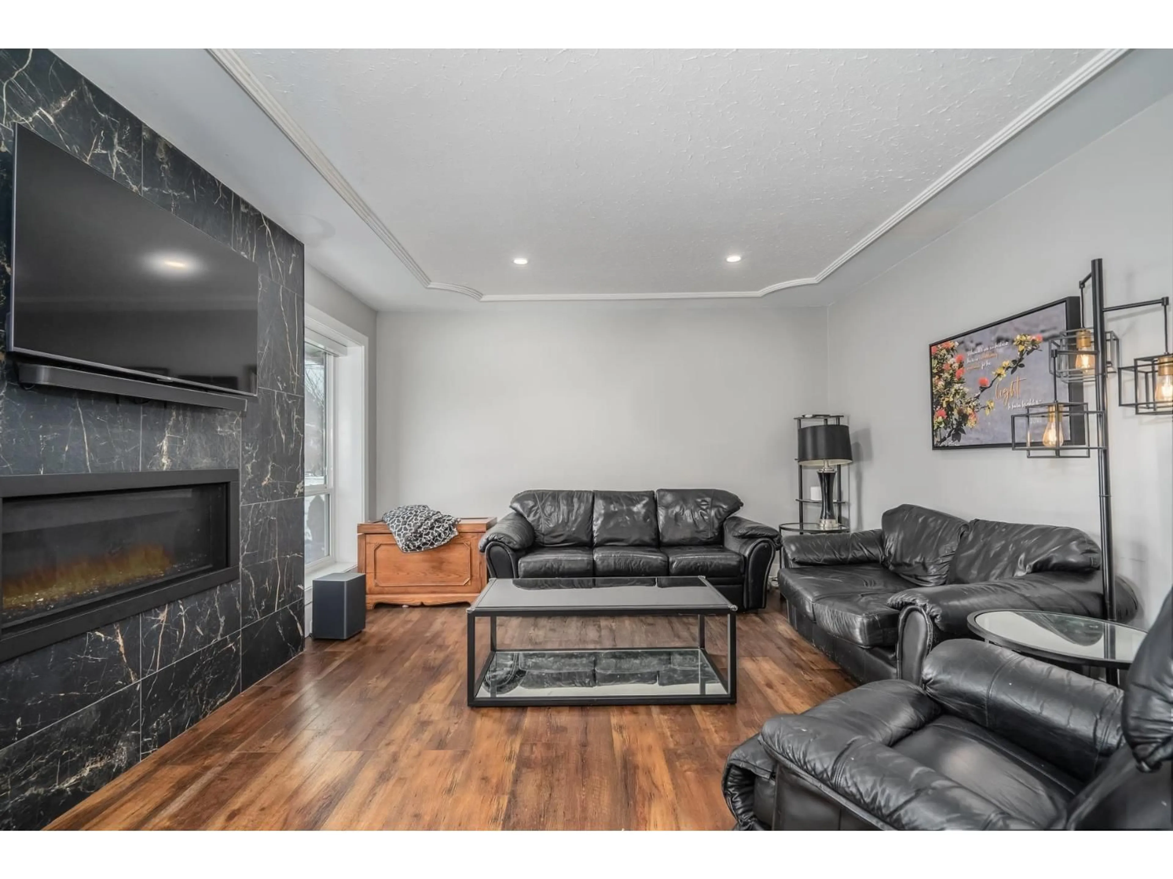 Living room with furniture, wood/laminate floor for 2319 HEMLOCK STREET, Abbotsford British Columbia V2T3A1