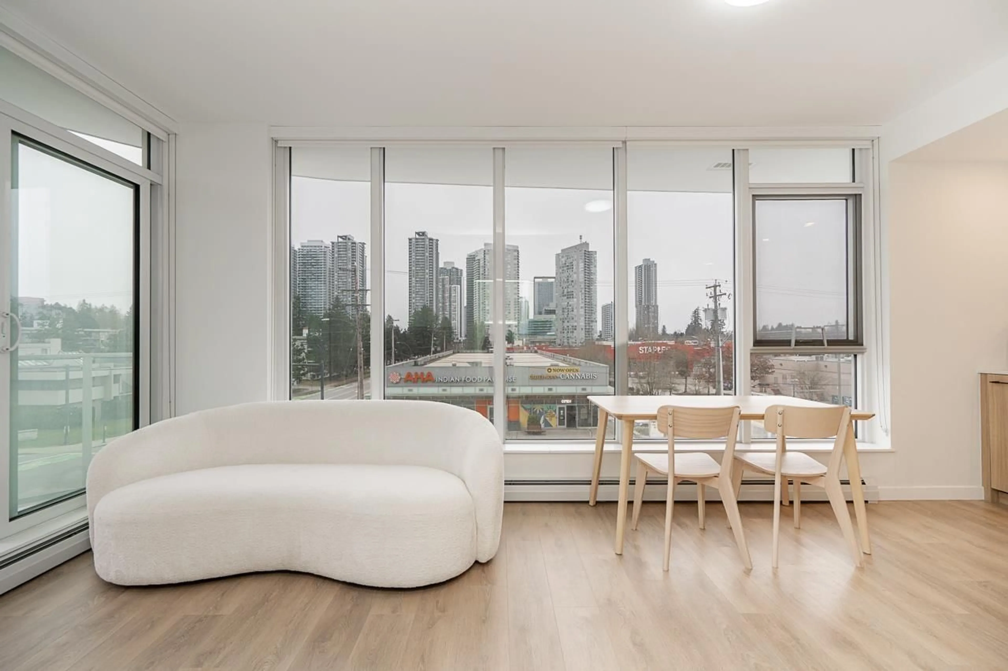 Living room with furniture, wood/laminate floor for 205 - 13685 102 AVENUE, Surrey British Columbia V3T0S2