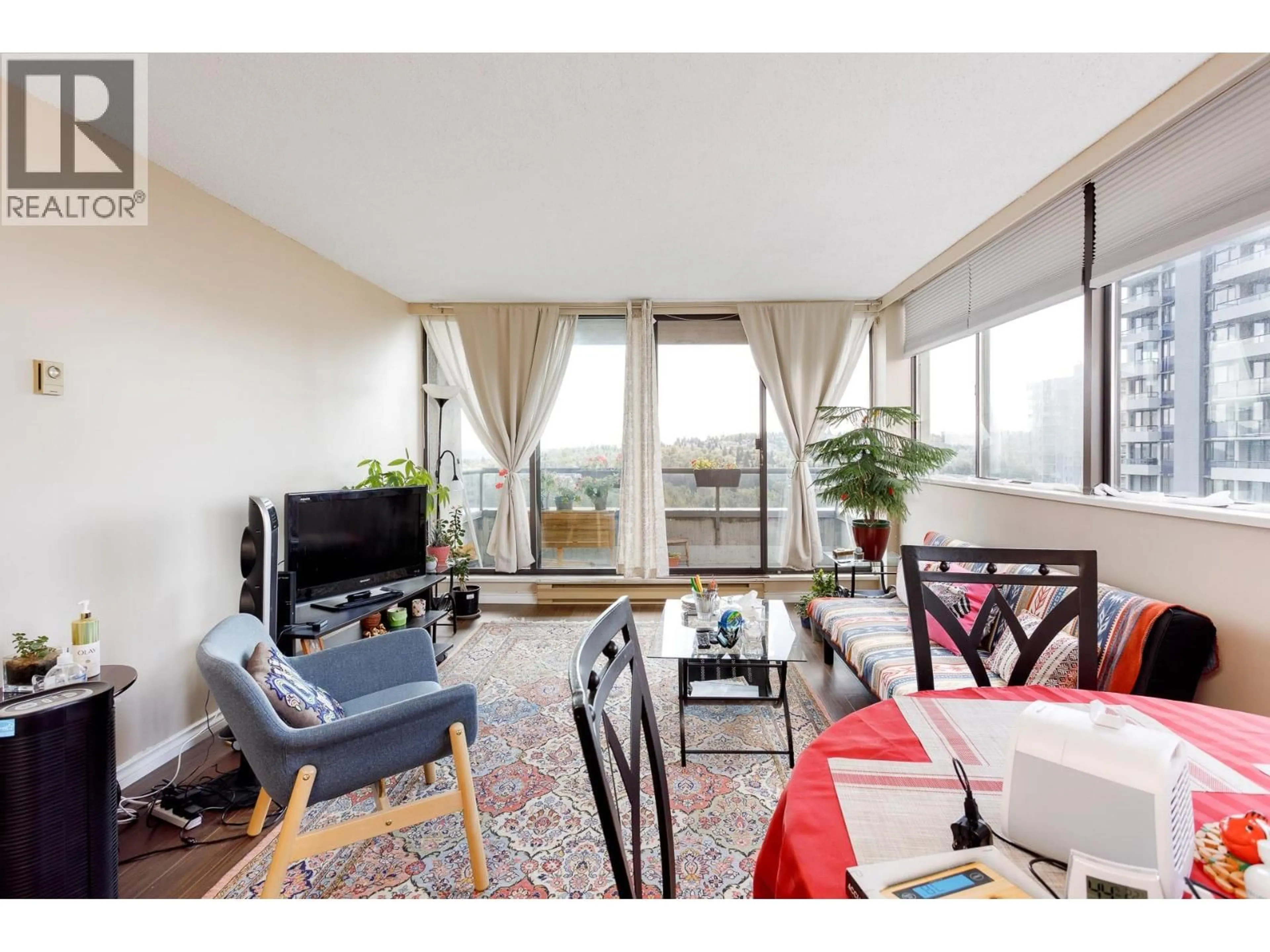 Living room with furniture, wood/laminate floor for 1504 - 3970 CARRIGAN COURT, Burnaby British Columbia V3N4S5