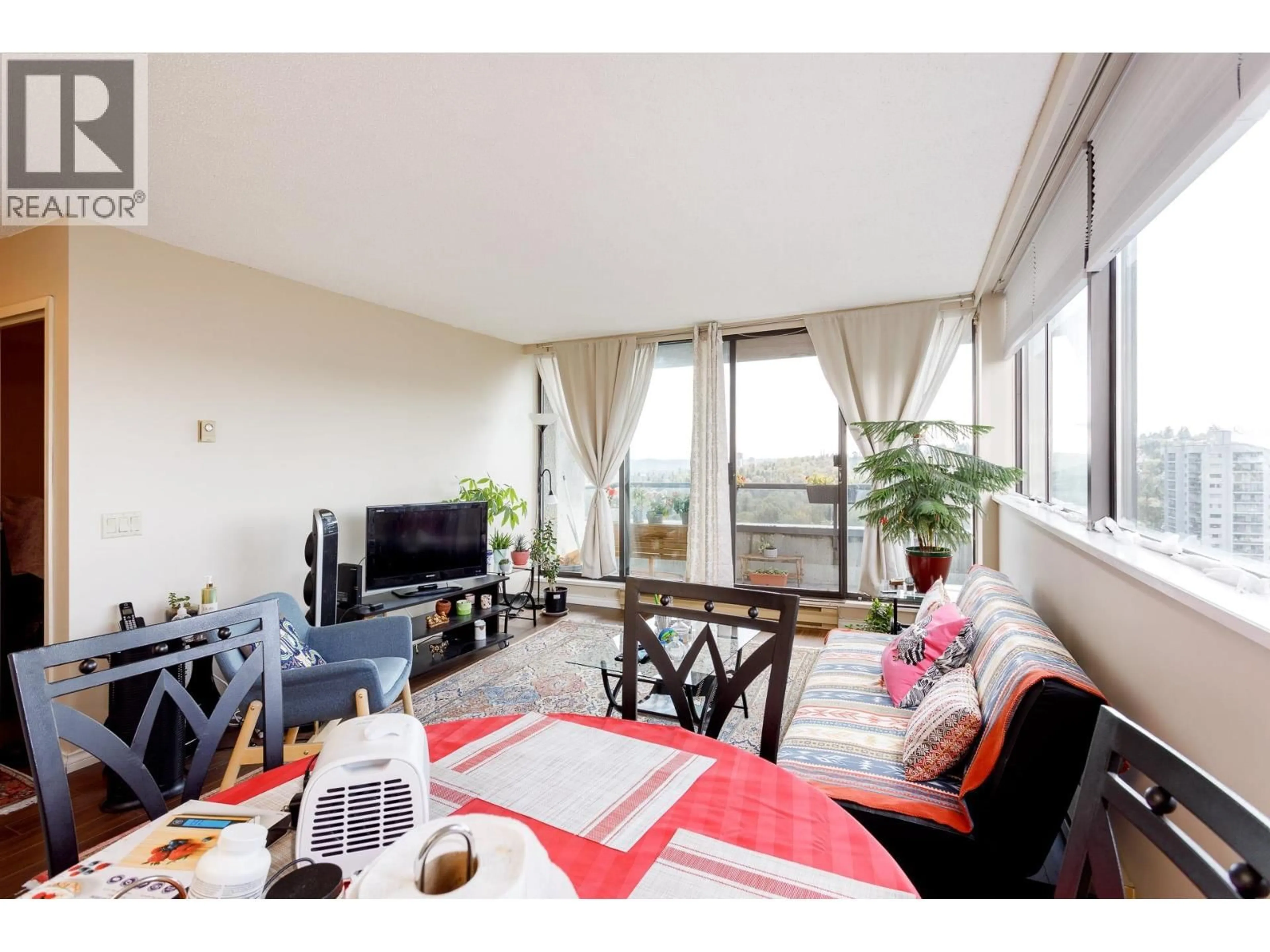 Living room with furniture, wood/laminate floor for 1504 - 3970 CARRIGAN COURT, Burnaby British Columbia V3N4S5