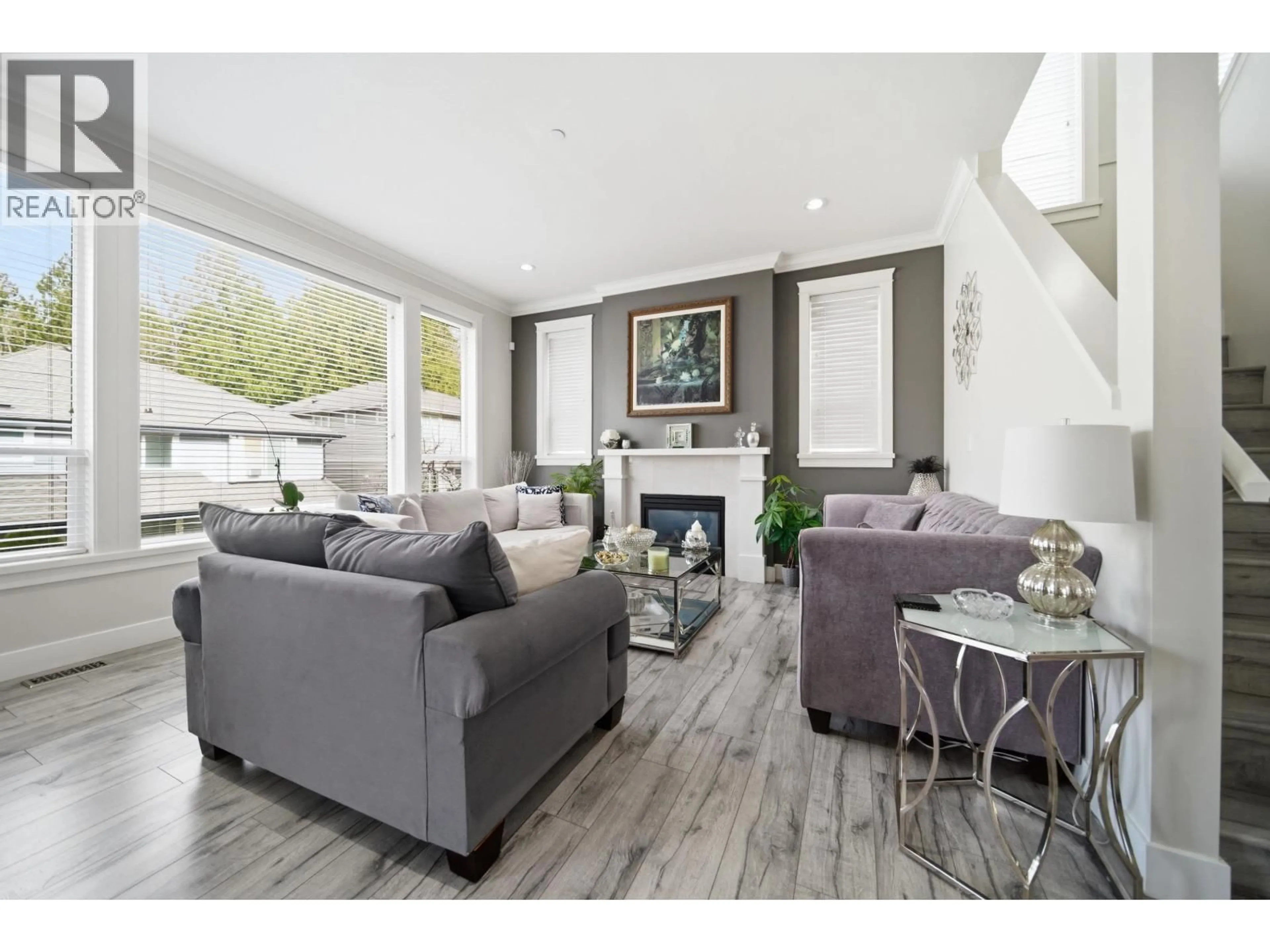 Living room with furniture, wood/laminate floor for 24345 104 AVENUE, Maple Ridge British Columbia V2W0G7