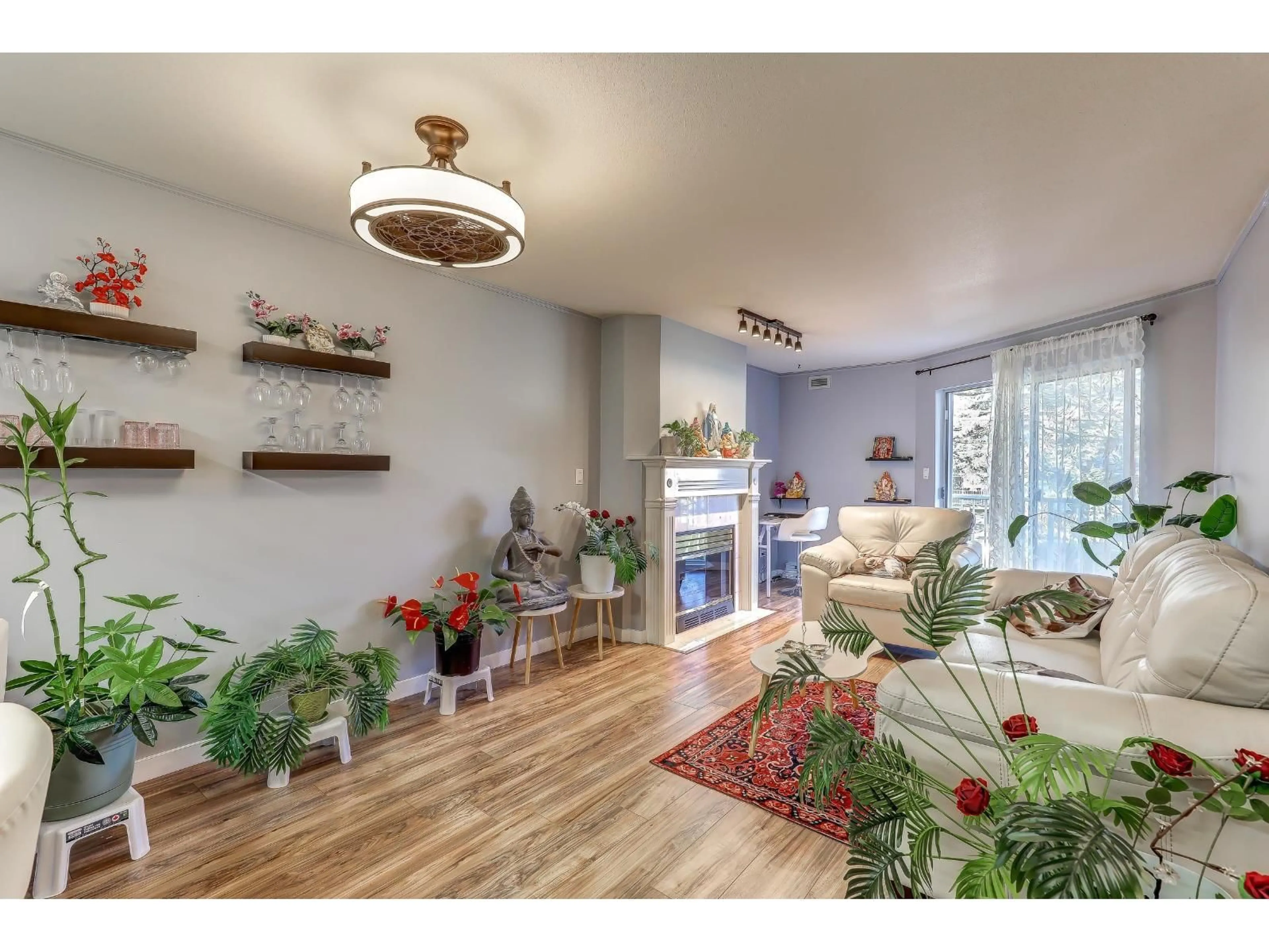 Living room with furniture, wood/laminate floor for 210 - 15110 108 AVENUE, Surrey British Columbia V3R0T6