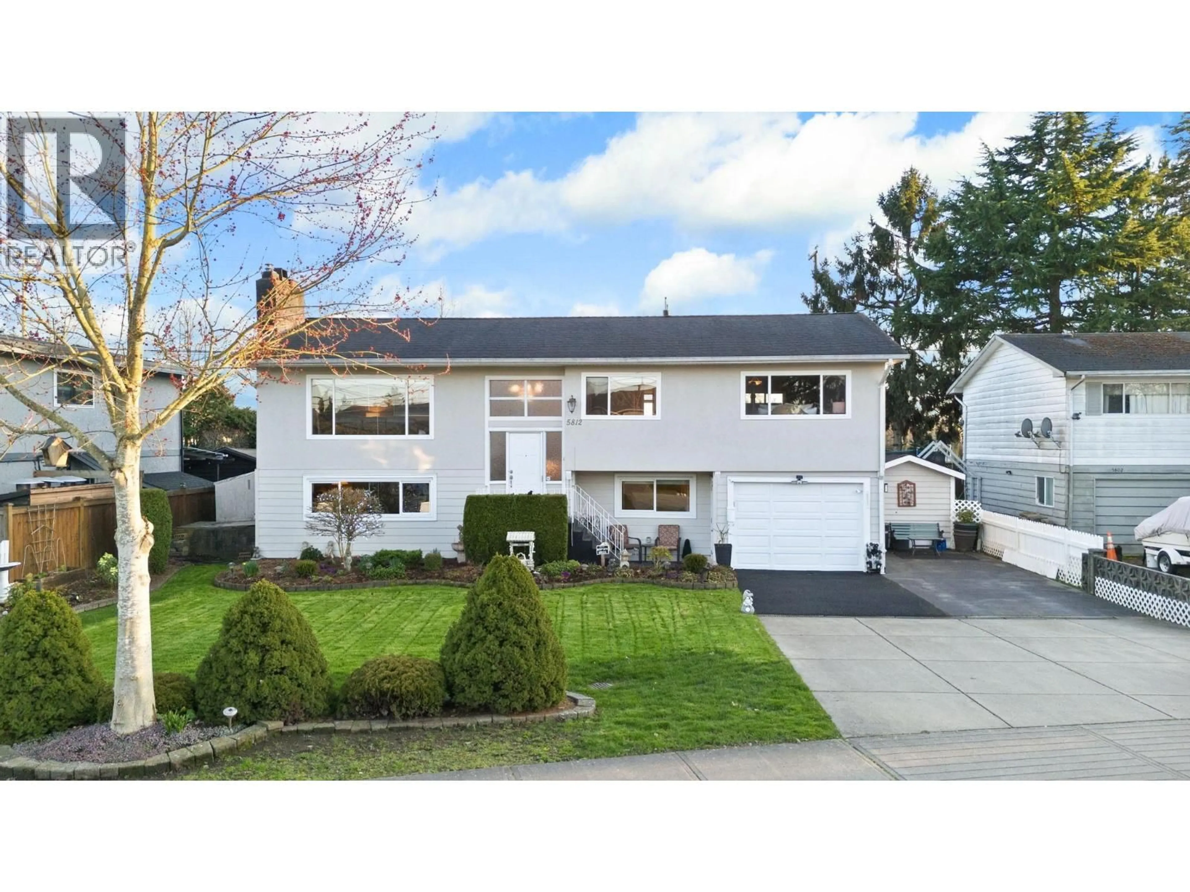 Home with vinyl exterior material, street for 5812 48A AVENUE, Delta British Columbia V4K1Y4