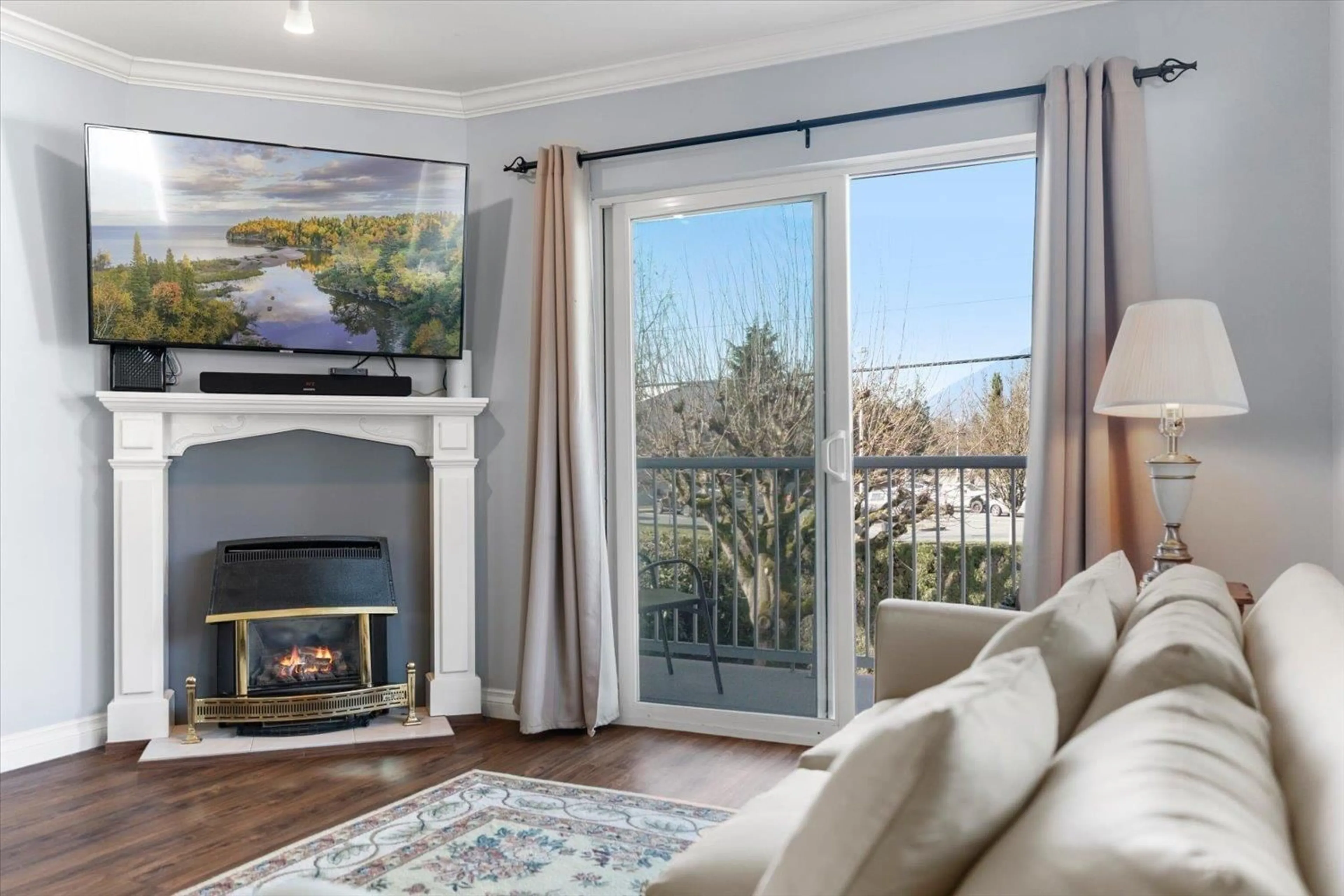 Living room with furniture, wood/laminate floor for 204 - 9175 EDWARD STREET, Chilliwack British Columbia V2P4C5