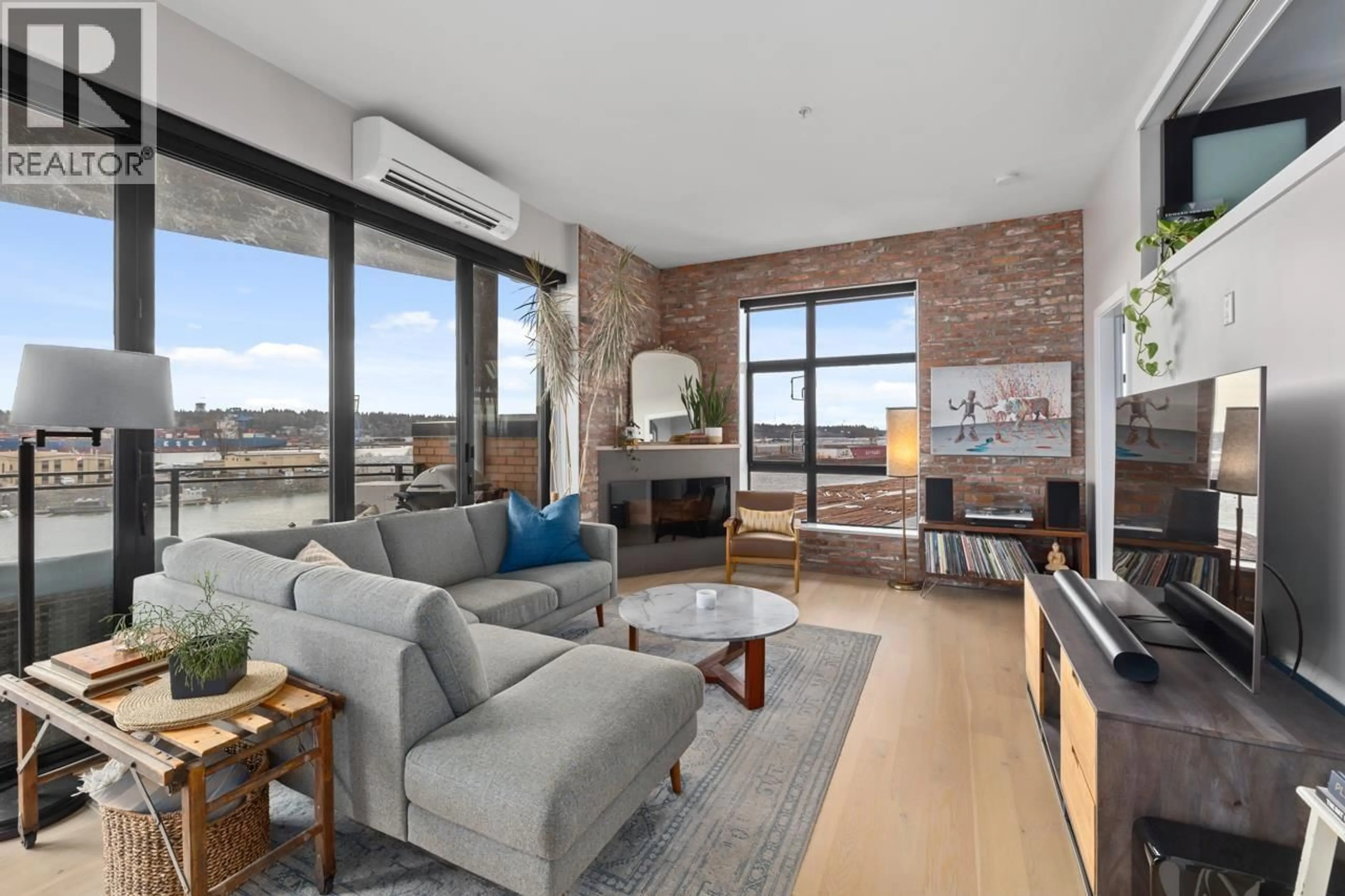 Living room with furniture, cement floor for 414 - 220 SALTER STREET, New Westminster British Columbia V3M0H4