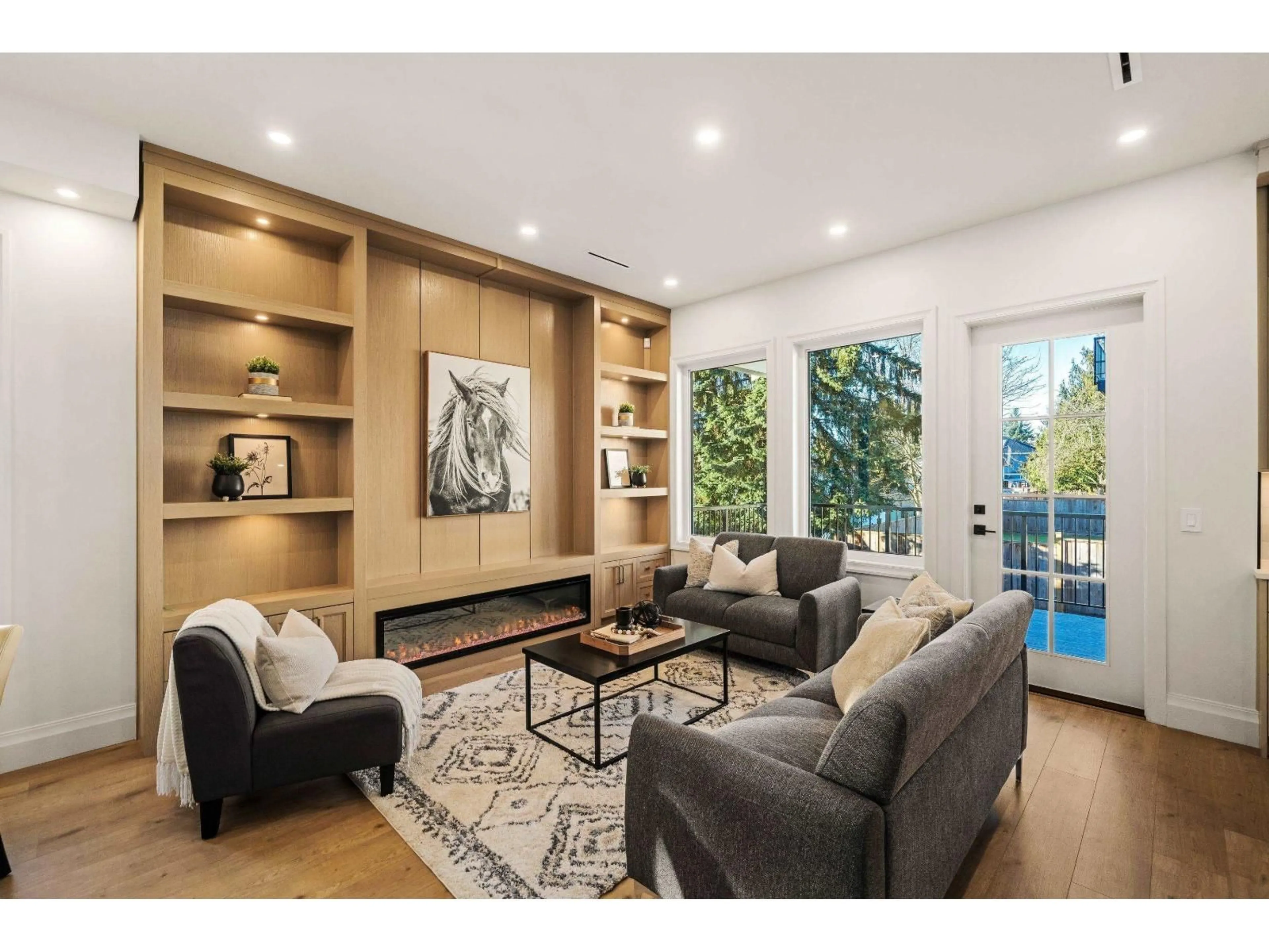 Living room with furniture, wood/laminate floor for 102 - 18171 59 AVENUE, Surrey British Columbia V3S5R8