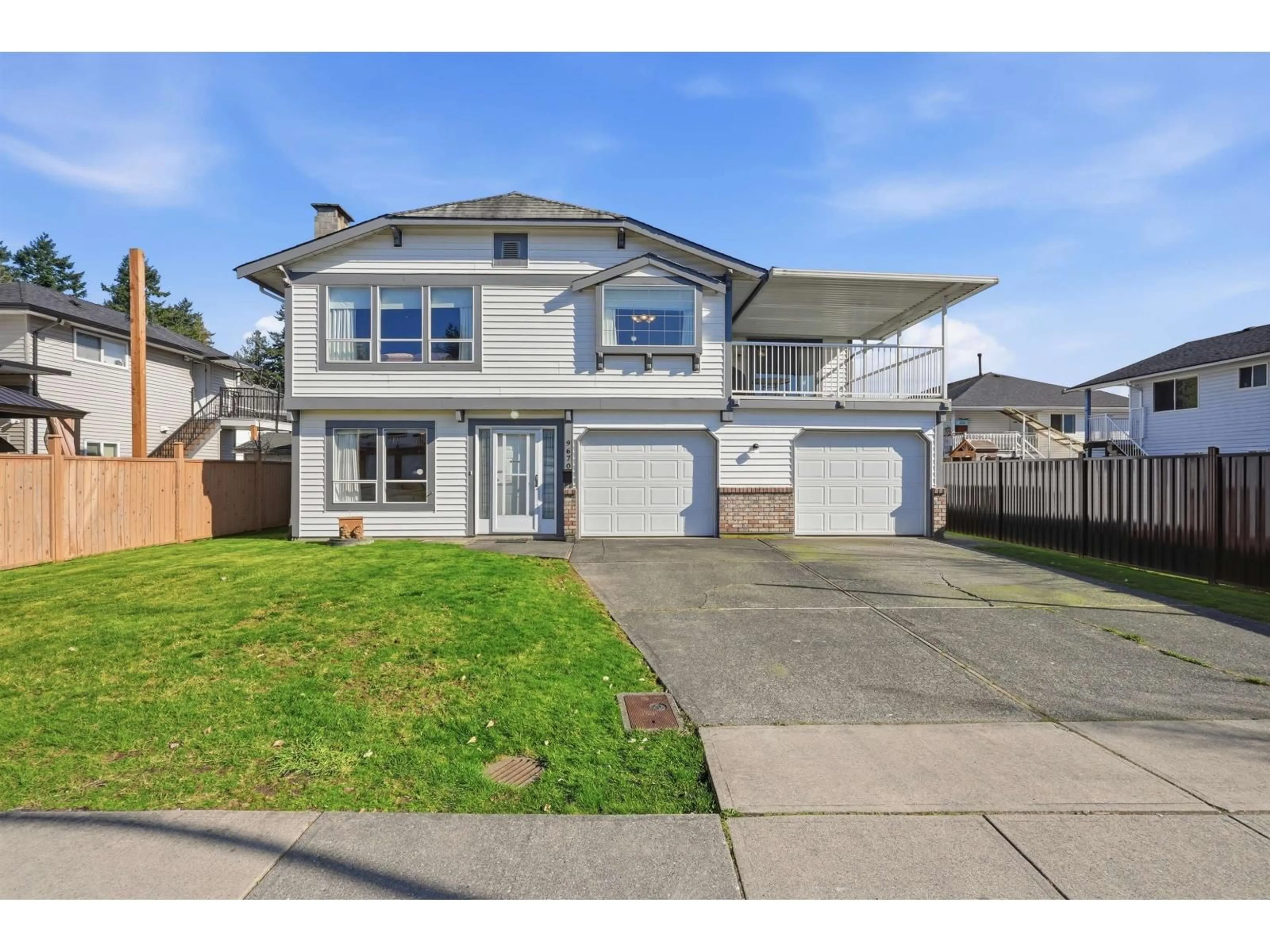 Home with vinyl exterior material, street for 9670 130 STREET, Surrey British Columbia V3T5N2