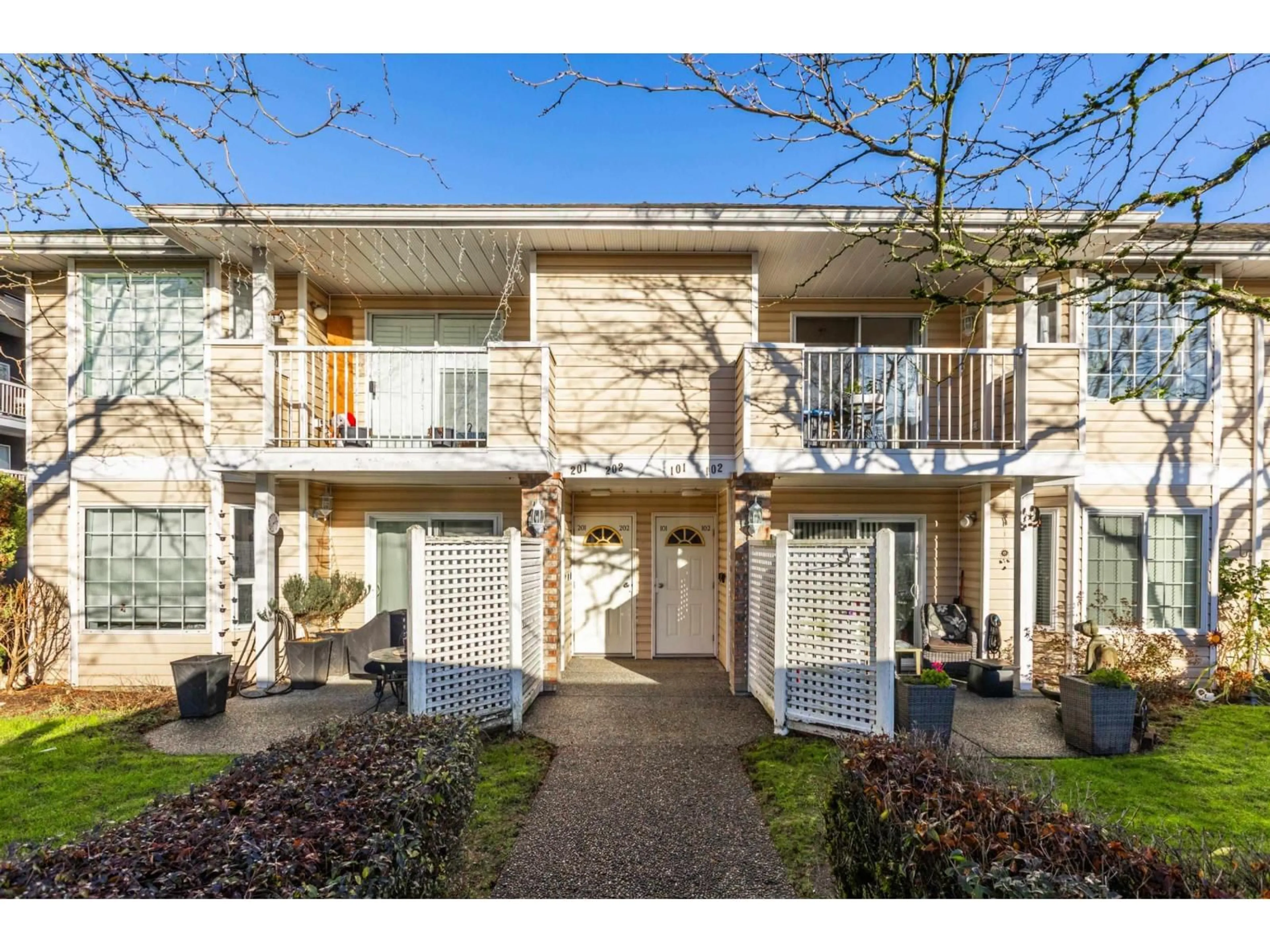 A pic from outside/outdoor area/front of a property/back of a property/a pic from drone, street for 202 - 5641 201 STREET, Langley British Columbia V3A8A4