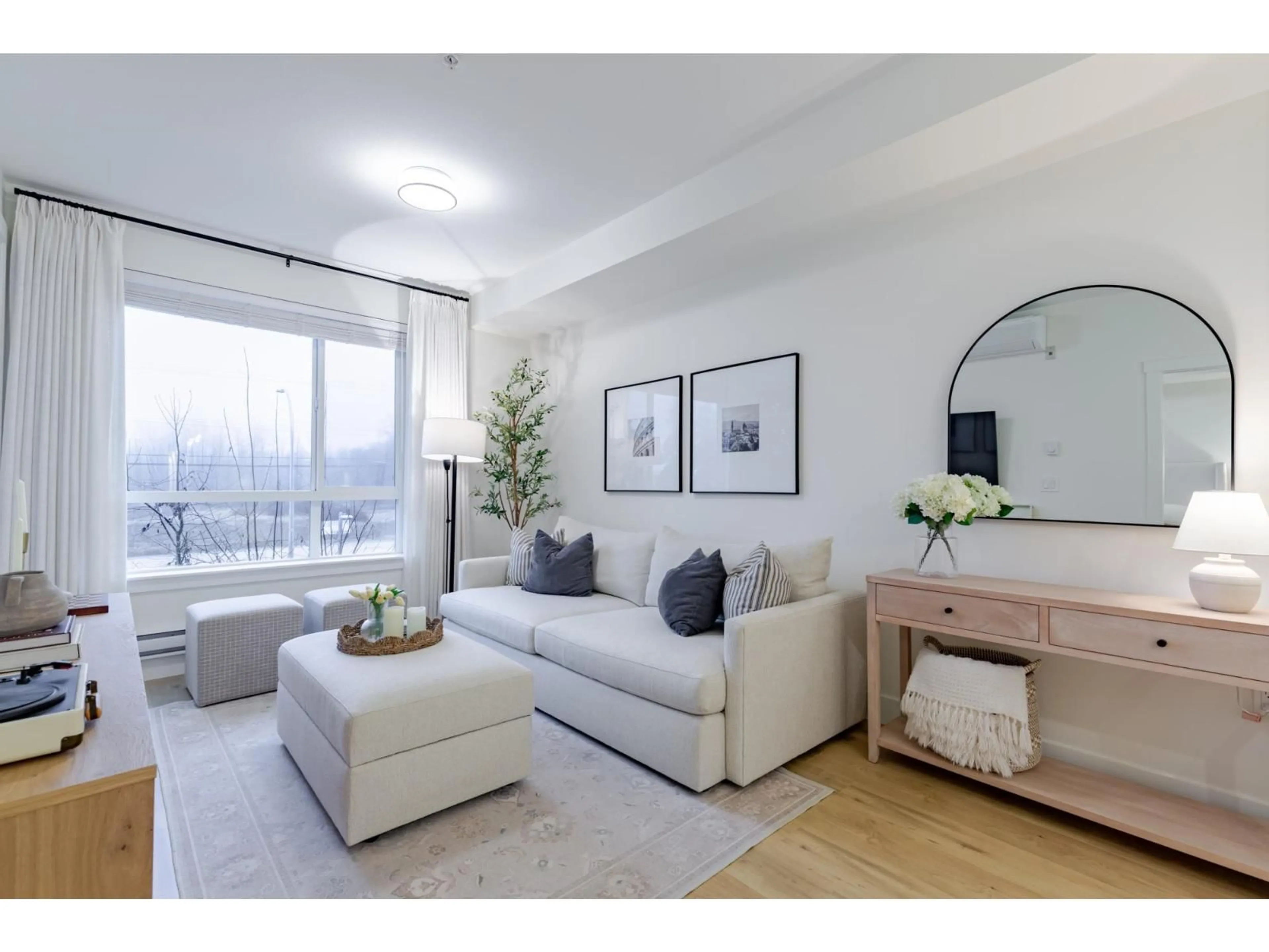 Living room with furniture, wood/laminate floor for 214 - 19935 75A AVENUE, Langley British Columbia V2Y4L6