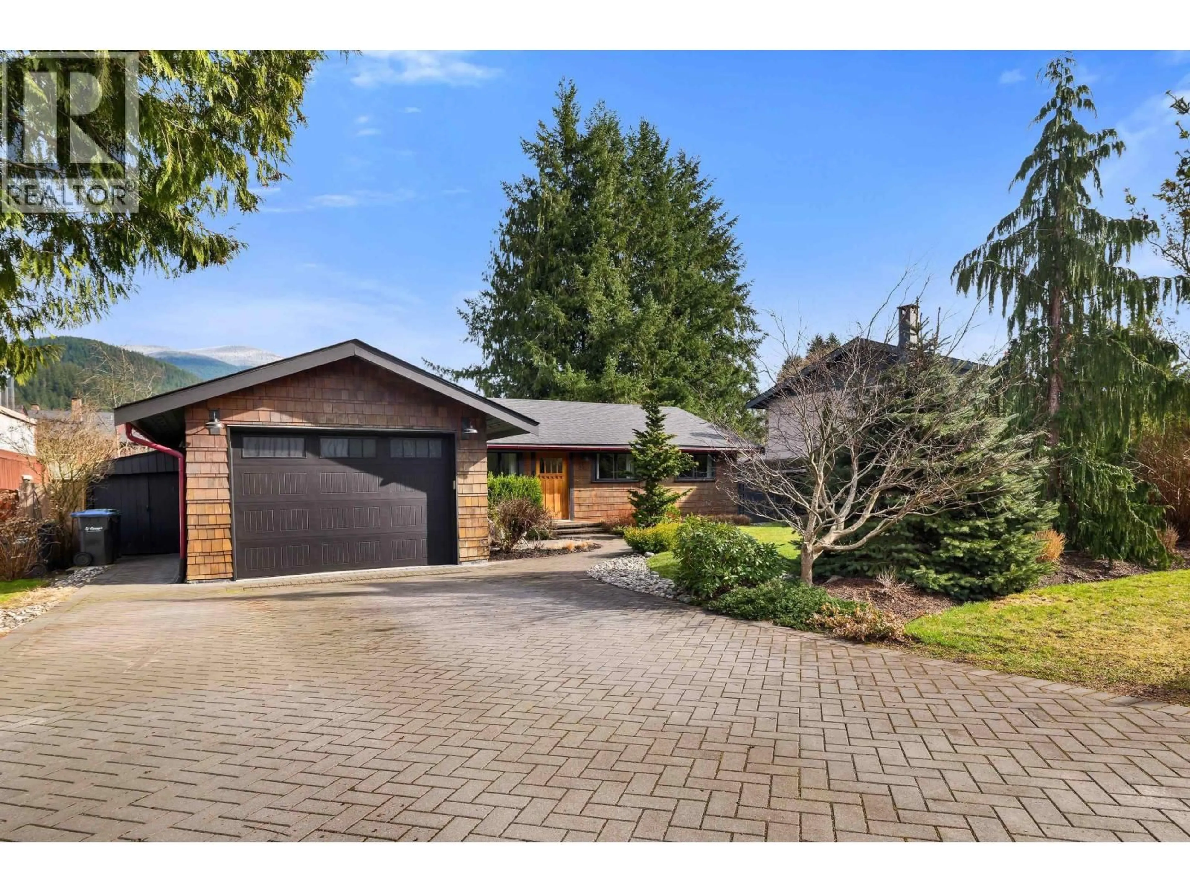 Home with brick exterior material, street for 1518 EAGLE RUN DRIVE, Squamish British Columbia V0N1H0