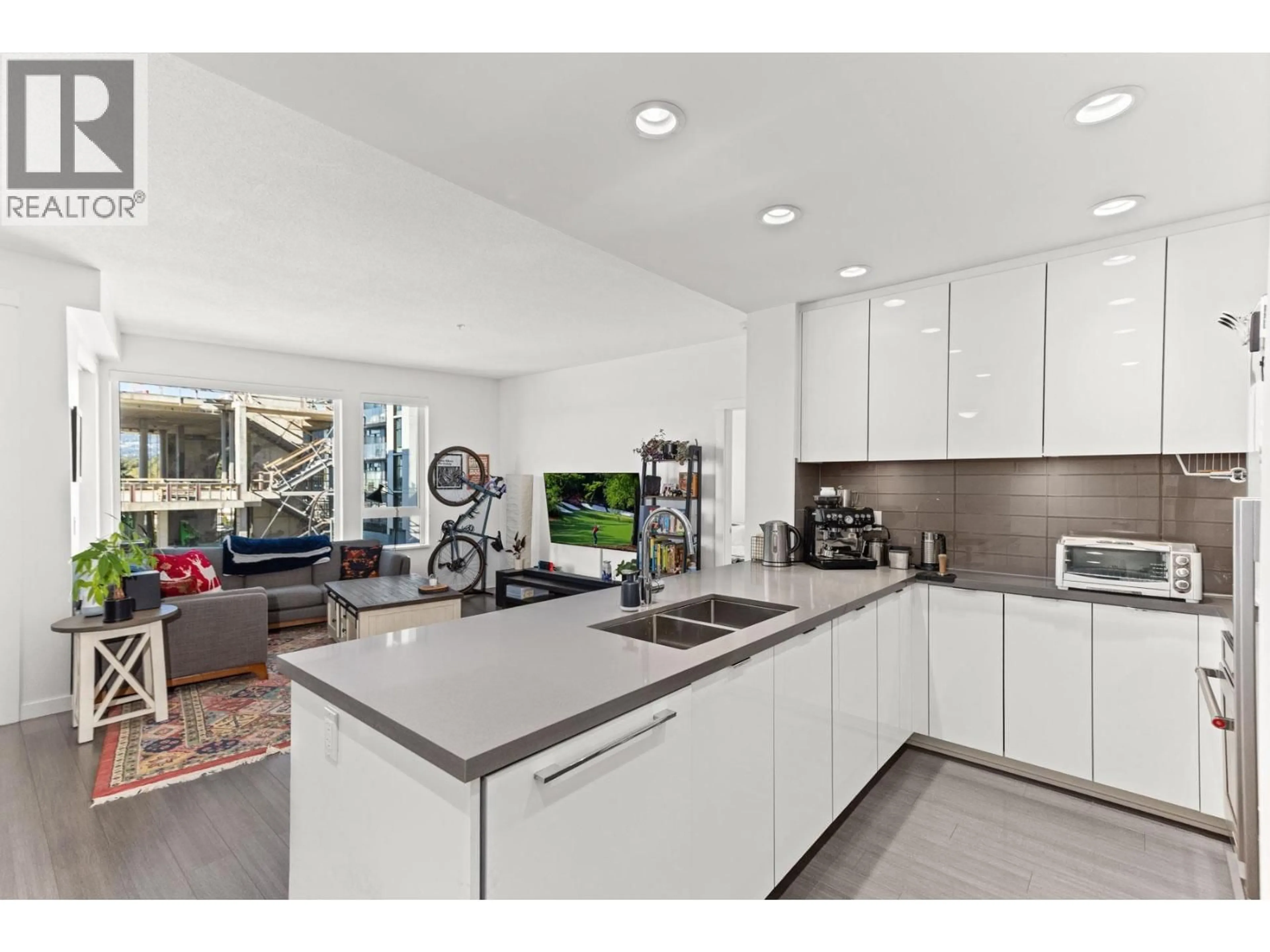 Open concept kitchen, ceramic/tile floor for 208 - 277 1ST STREET, North Vancouver British Columbia V7M0E8