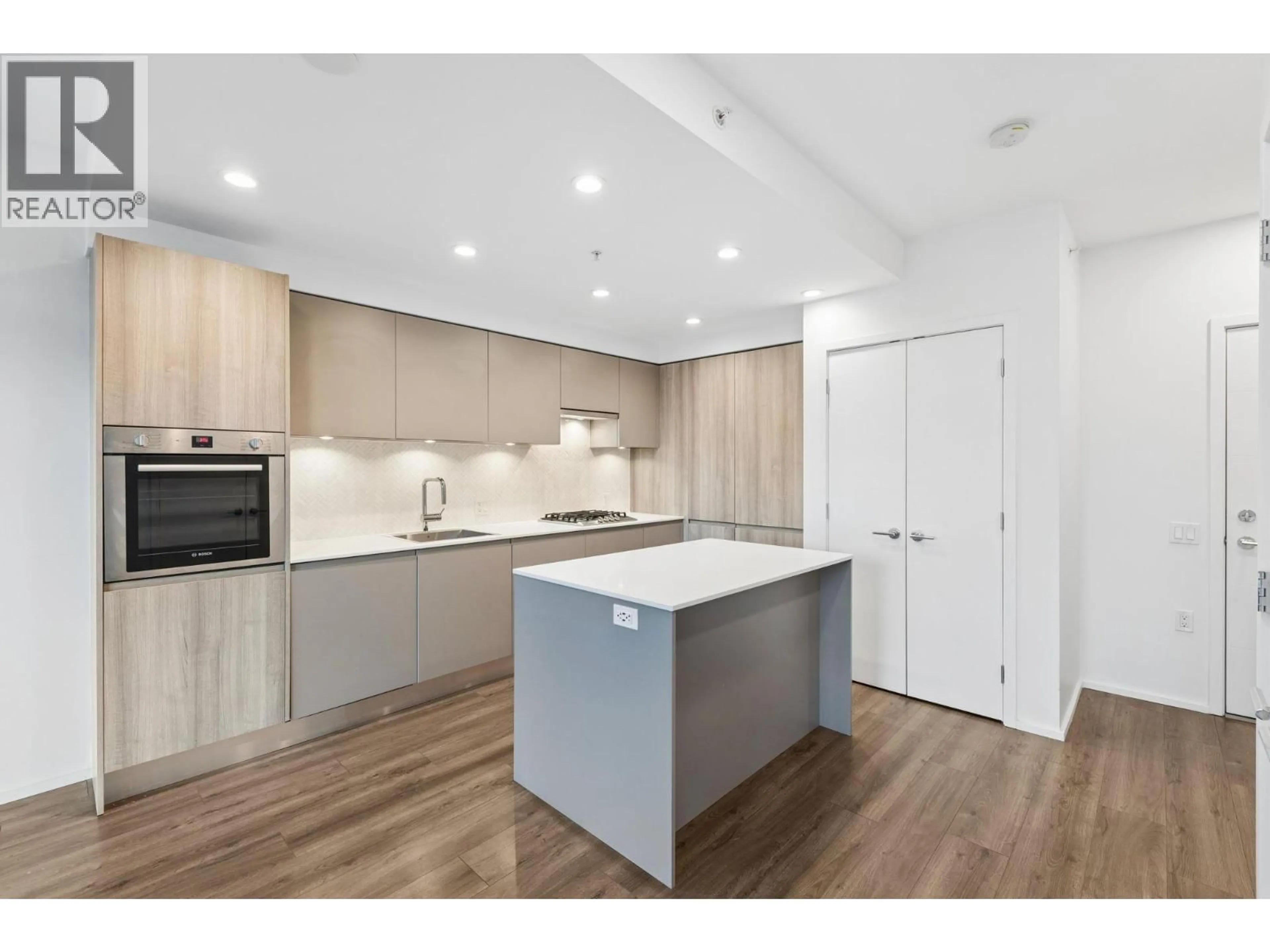 Open concept kitchen, wood/laminate floor for 304 - 3809 EVERGREEN PLACE, Burnaby British Columbia V3J0M1