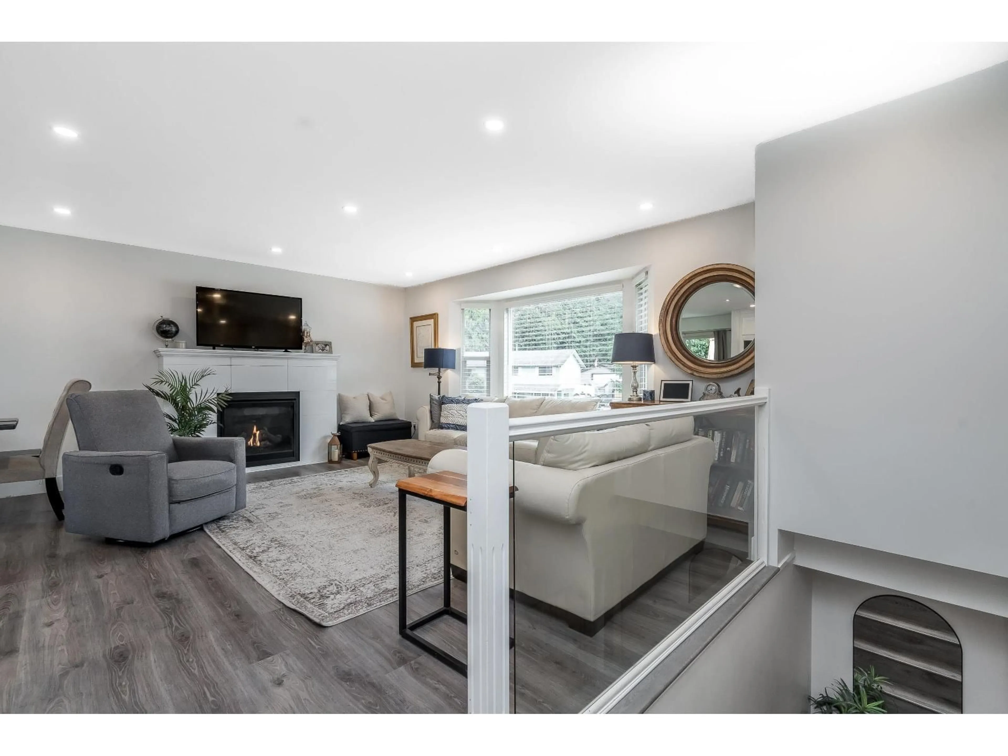 Living room with furniture, wood/laminate floor for 4427 202 STREET, Langley British Columbia V3A6R6