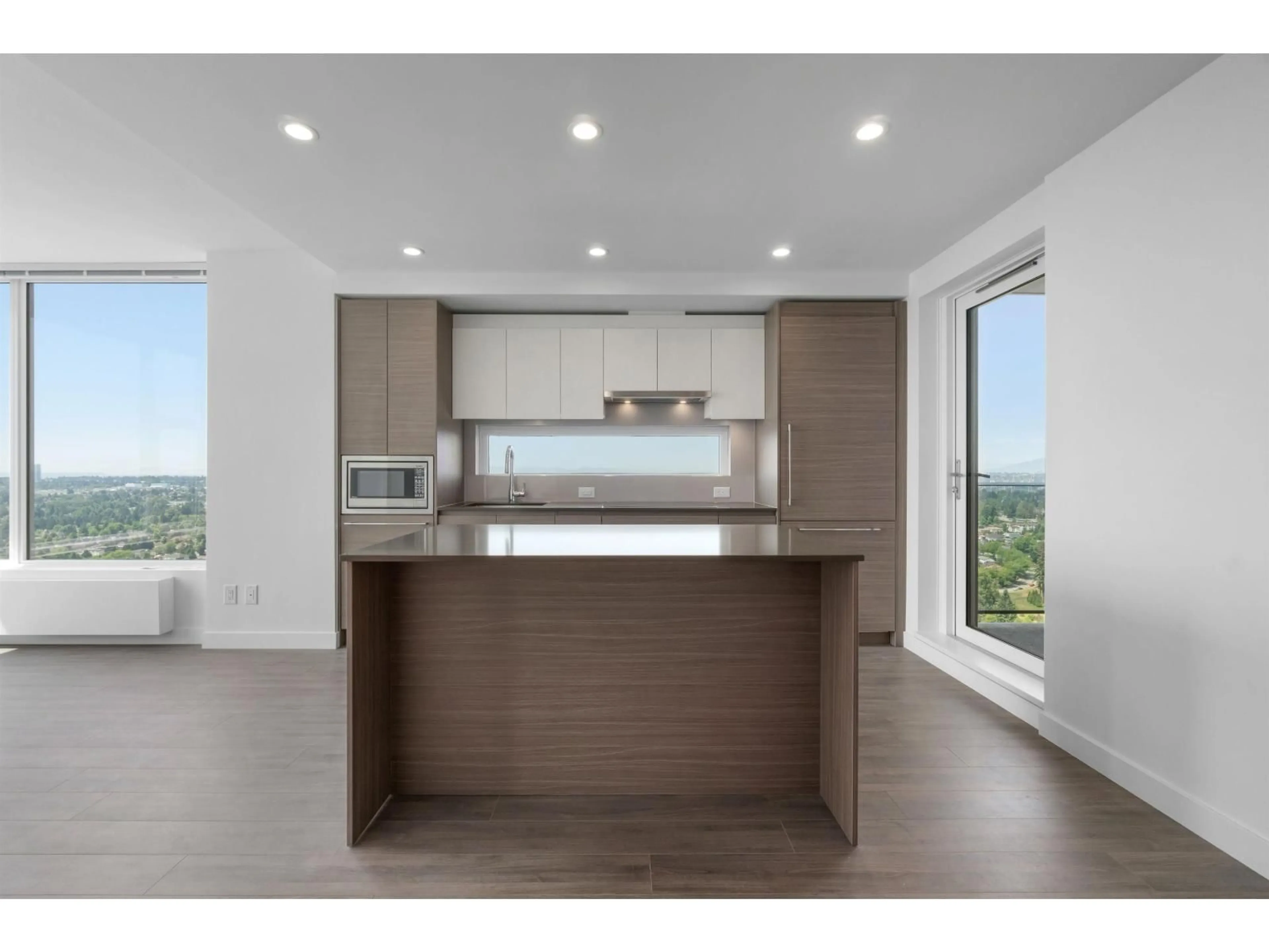 Open concept kitchen, wood/laminate floor for 3803 - 13615 FRASER HIGHWAY, Surrey British Columbia V3T0P7