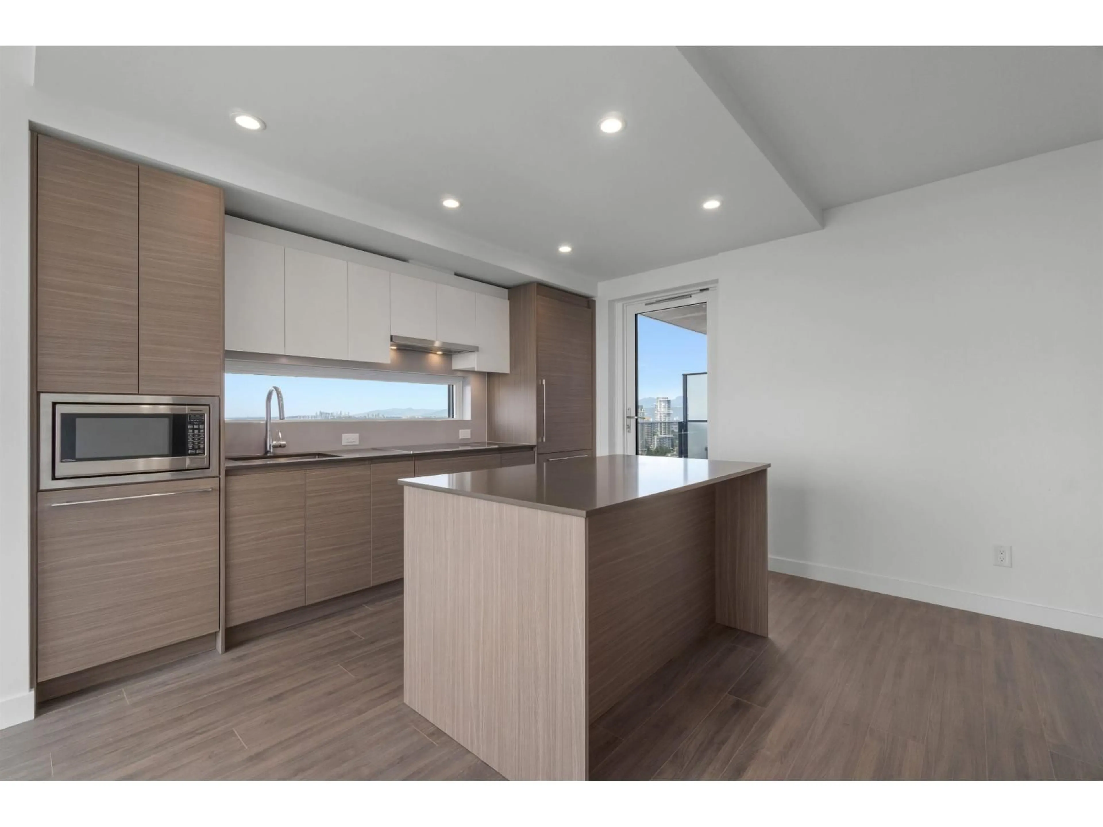 Open concept kitchen, wood/laminate floor for 3803 - 13615 FRASER HIGHWAY, Surrey British Columbia V3T0P7