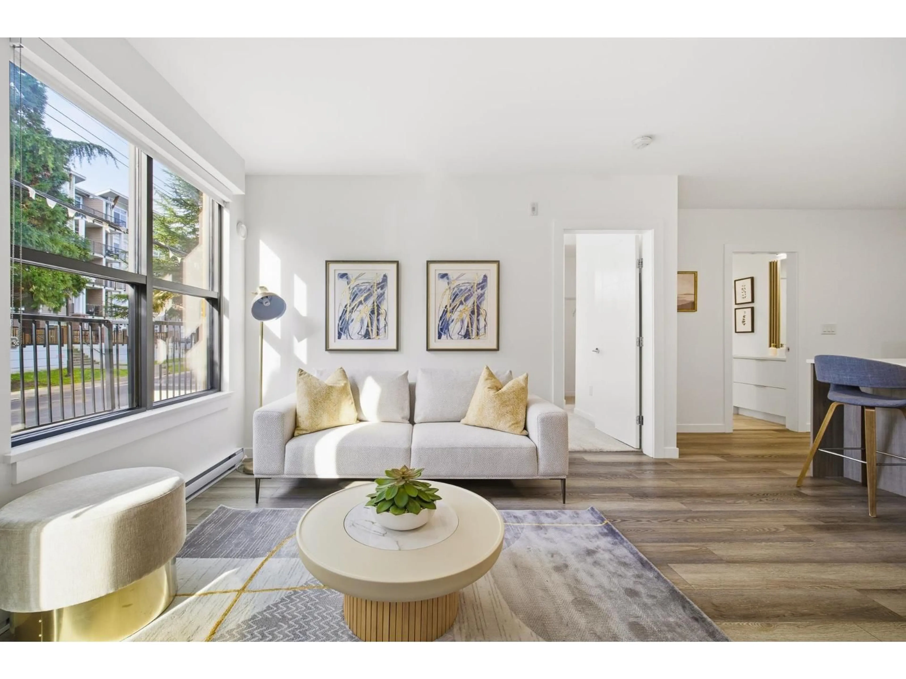 Living room with furniture, wood/laminate floor for 103 - 20695 EASTLEIGH CRESCENT, Langley British Columbia V3A0P7