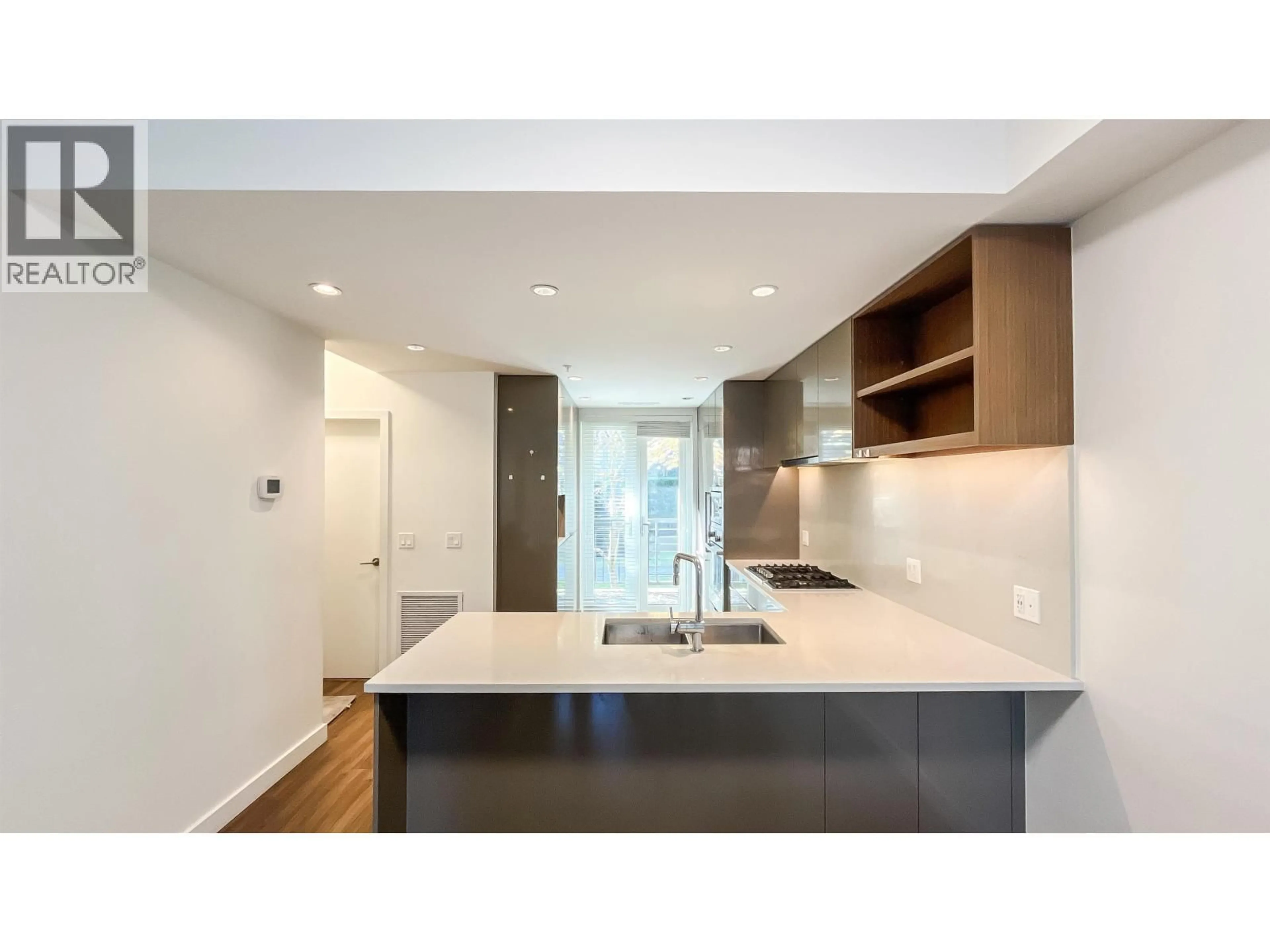 Open concept kitchen, wood/laminate floor for 27 - 388 64TH AVENUE, Vancouver British Columbia V5X2L9