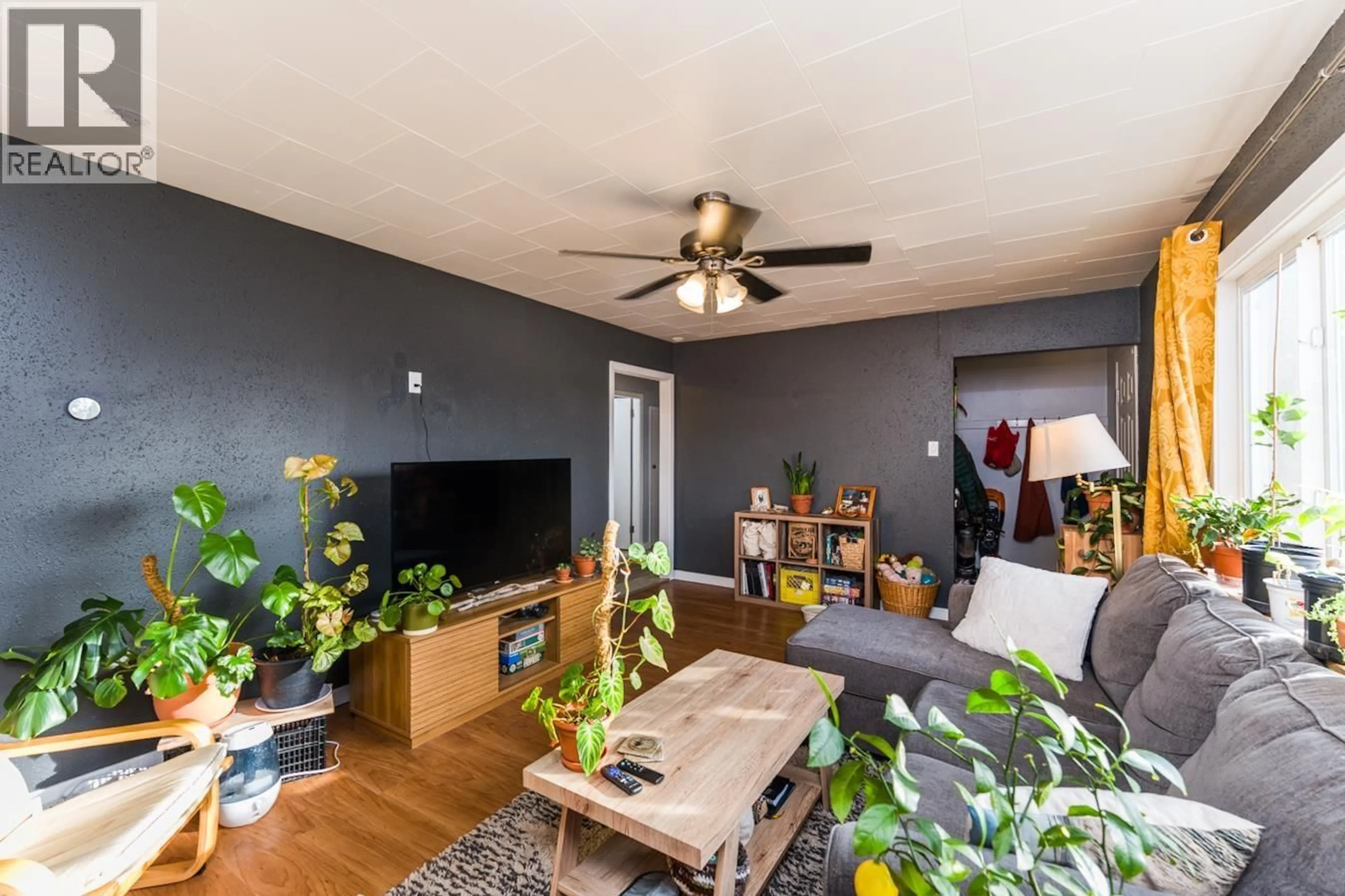 Living room with furniture, wood/laminate floor for 1180 CUDDIE CRESCENT, Prince George British Columbia V2L4C5