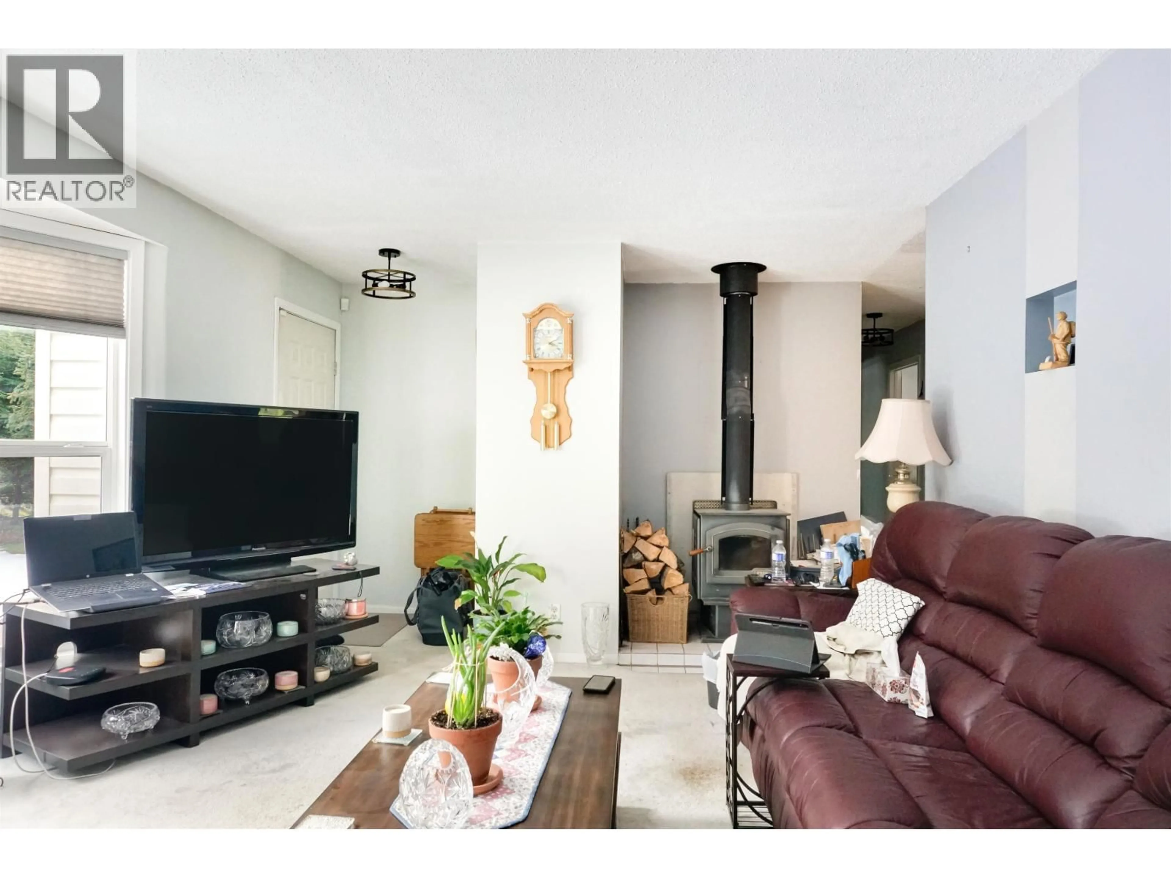 Living room with furniture, wood/laminate floor for 4532 BEAM STATION DRIVE, Terrace British Columbia V8C4B1