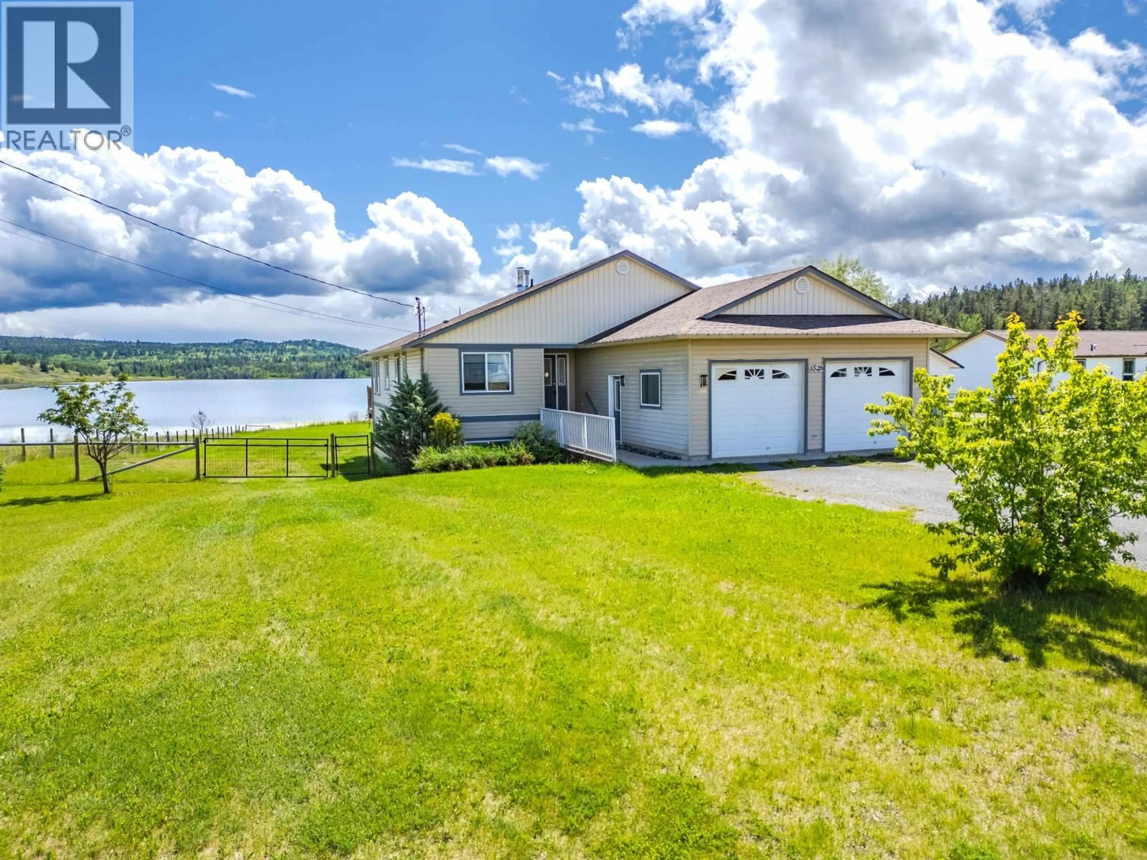 A pic from outside/outdoor area/front of a property/back of a property/a pic from drone, water/lake/river/ocean view for 5526 LAKESIDE COURT, 103 Mile House British Columbia V0K2E1