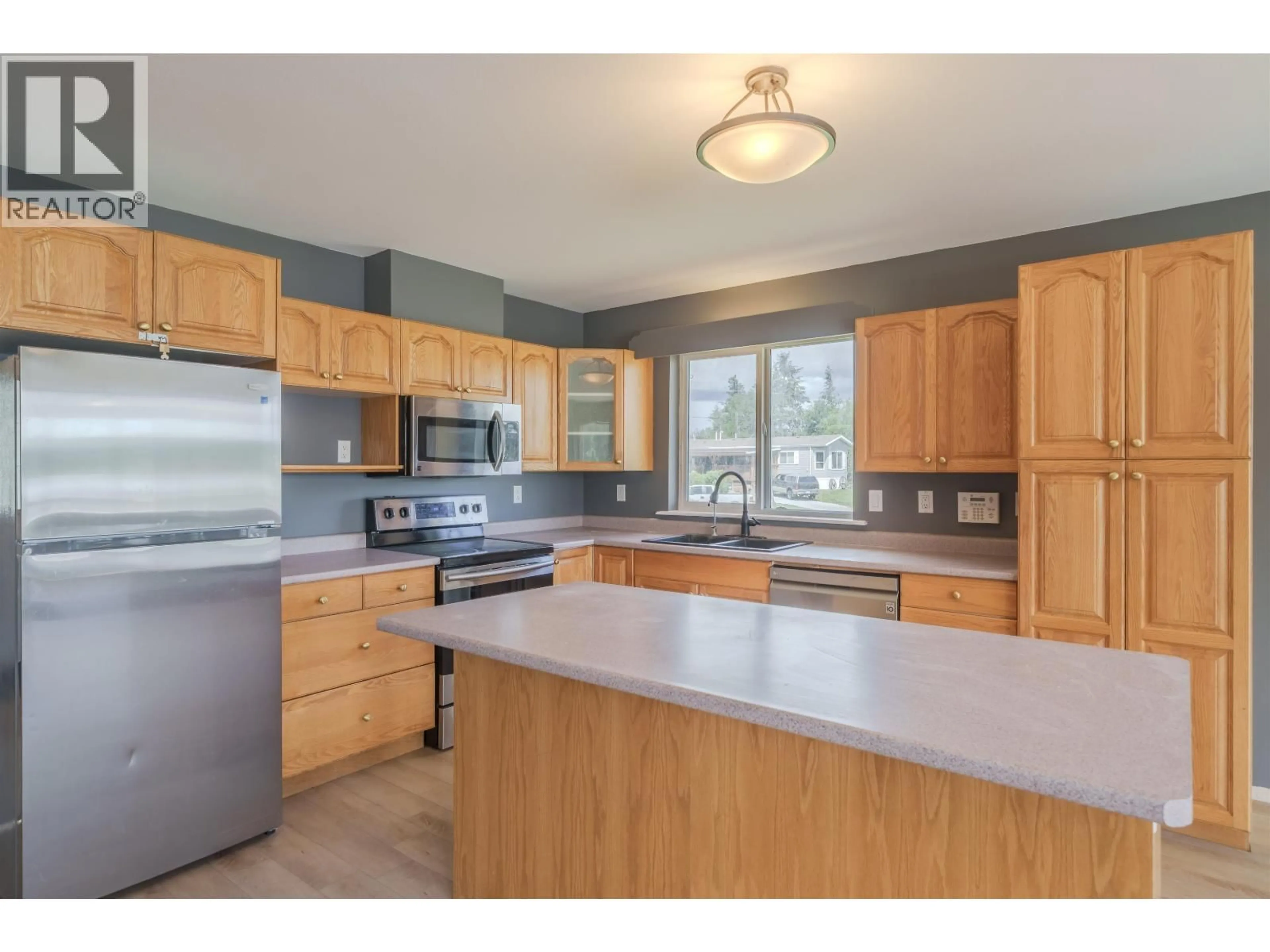 Open concept kitchen, unknown for 5526 LAKESIDE COURT, 103 Mile House British Columbia V0K2E1