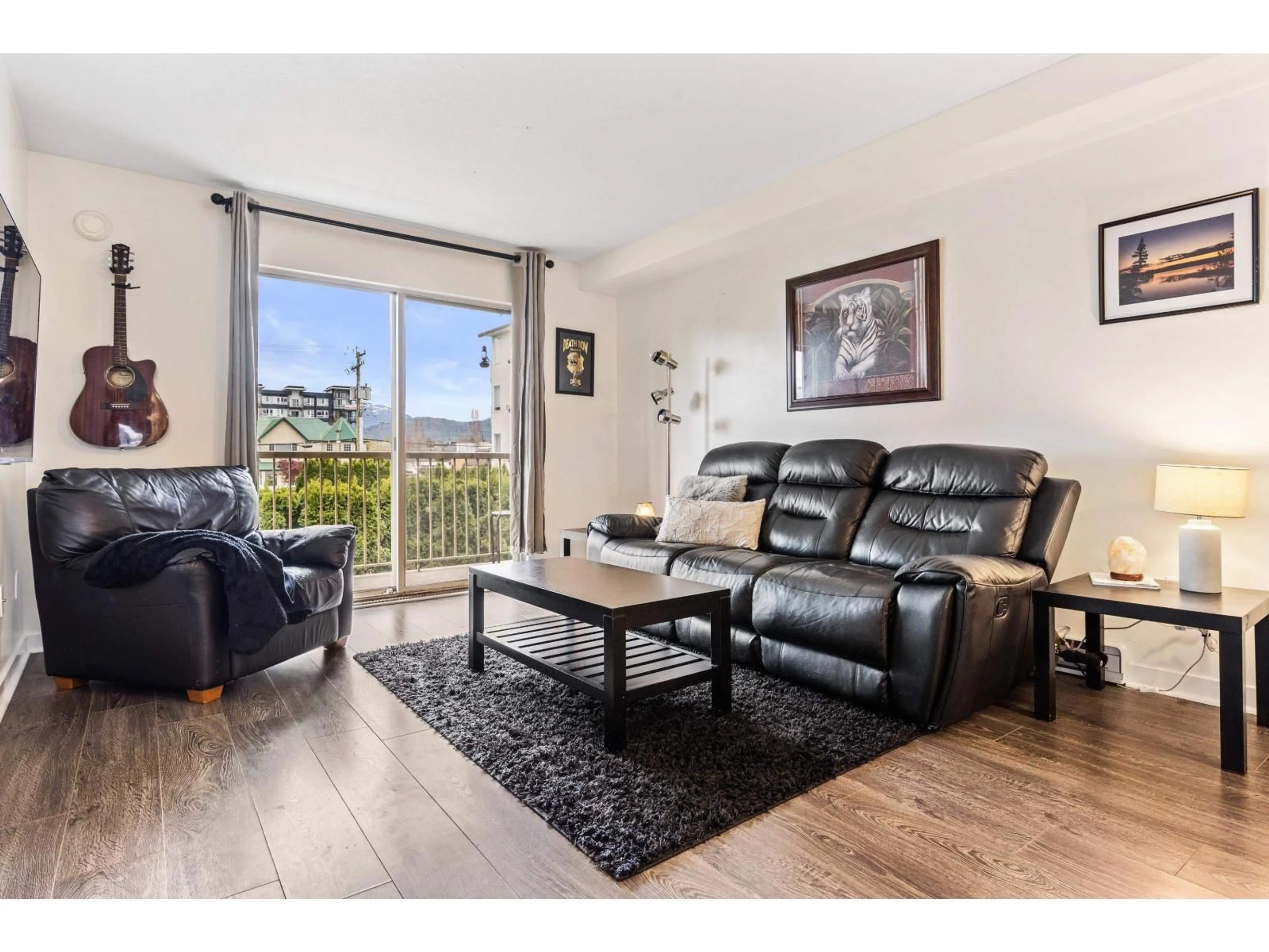 Living room with furniture, wood/laminate floor for 207 - 7435 SHAW AVENUE, Chilliwack British Columbia V2R3C1