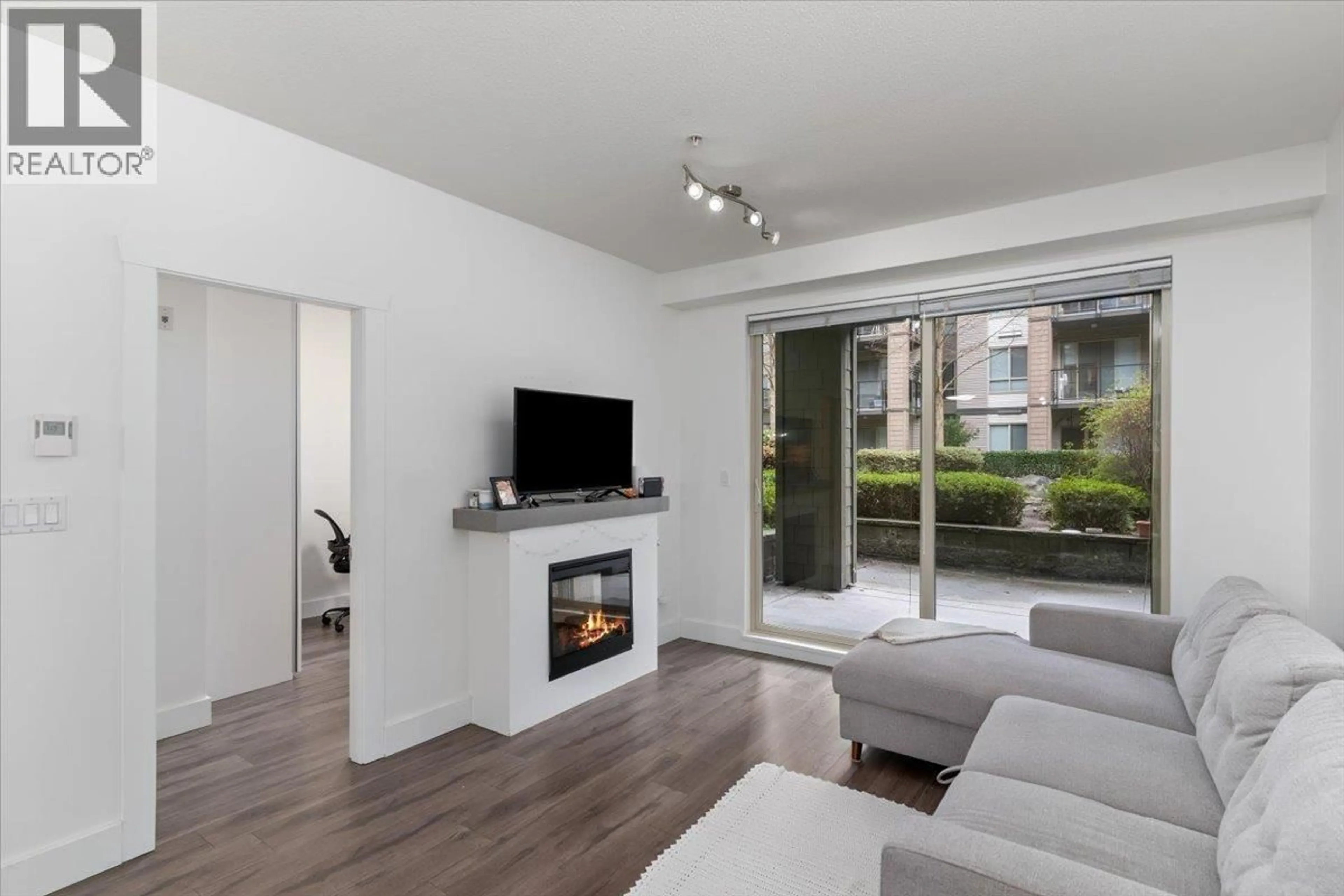 Living room with furniture, wood/laminate floor for 112 - 7478 BYRNEPARK WALK, Burnaby British Columbia V3N0B5