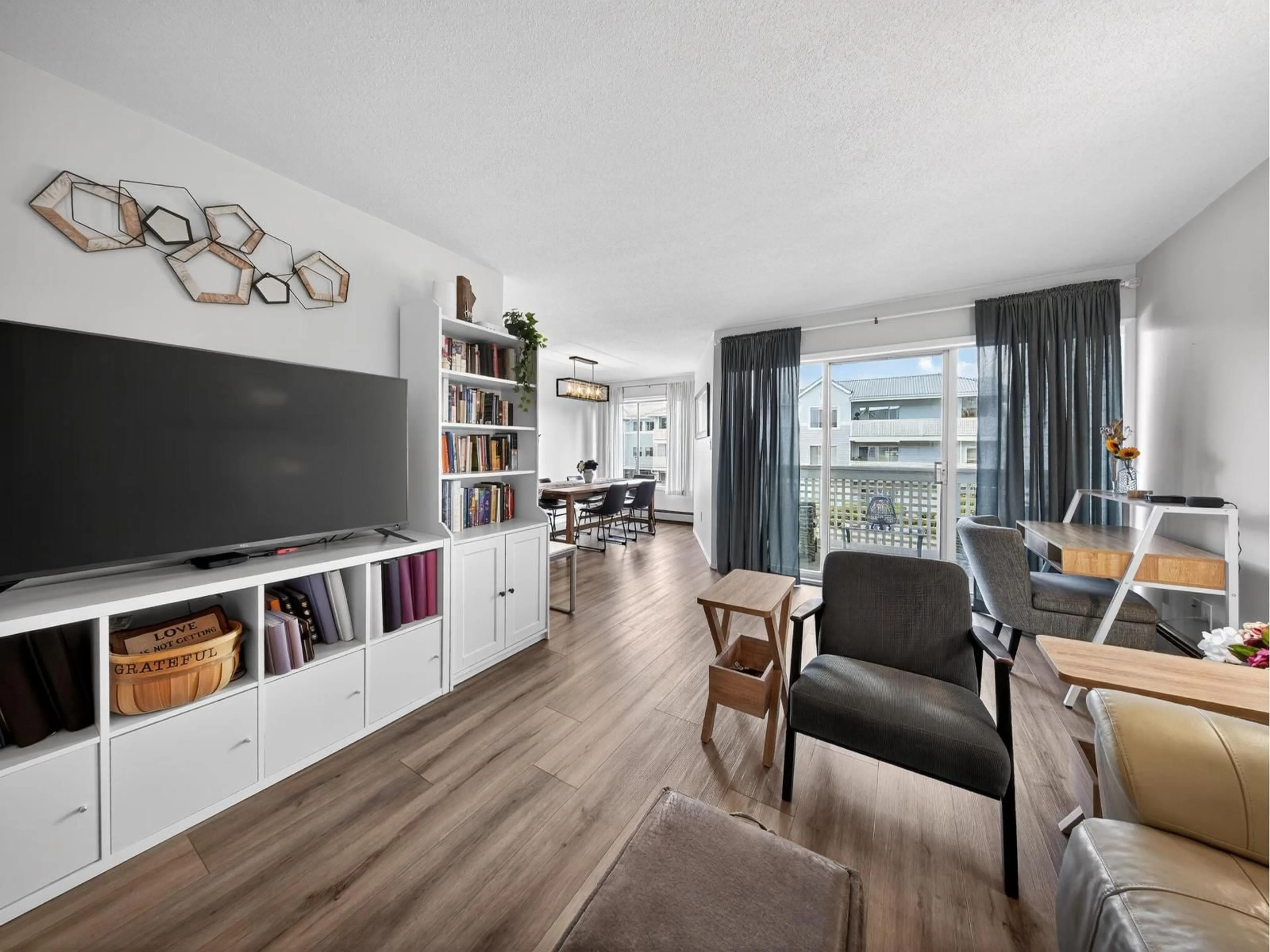 Living room with furniture, wood/laminate floor for 216 - 32833 LANDEAU PLACE, Abbotsford British Columbia V2S6S6