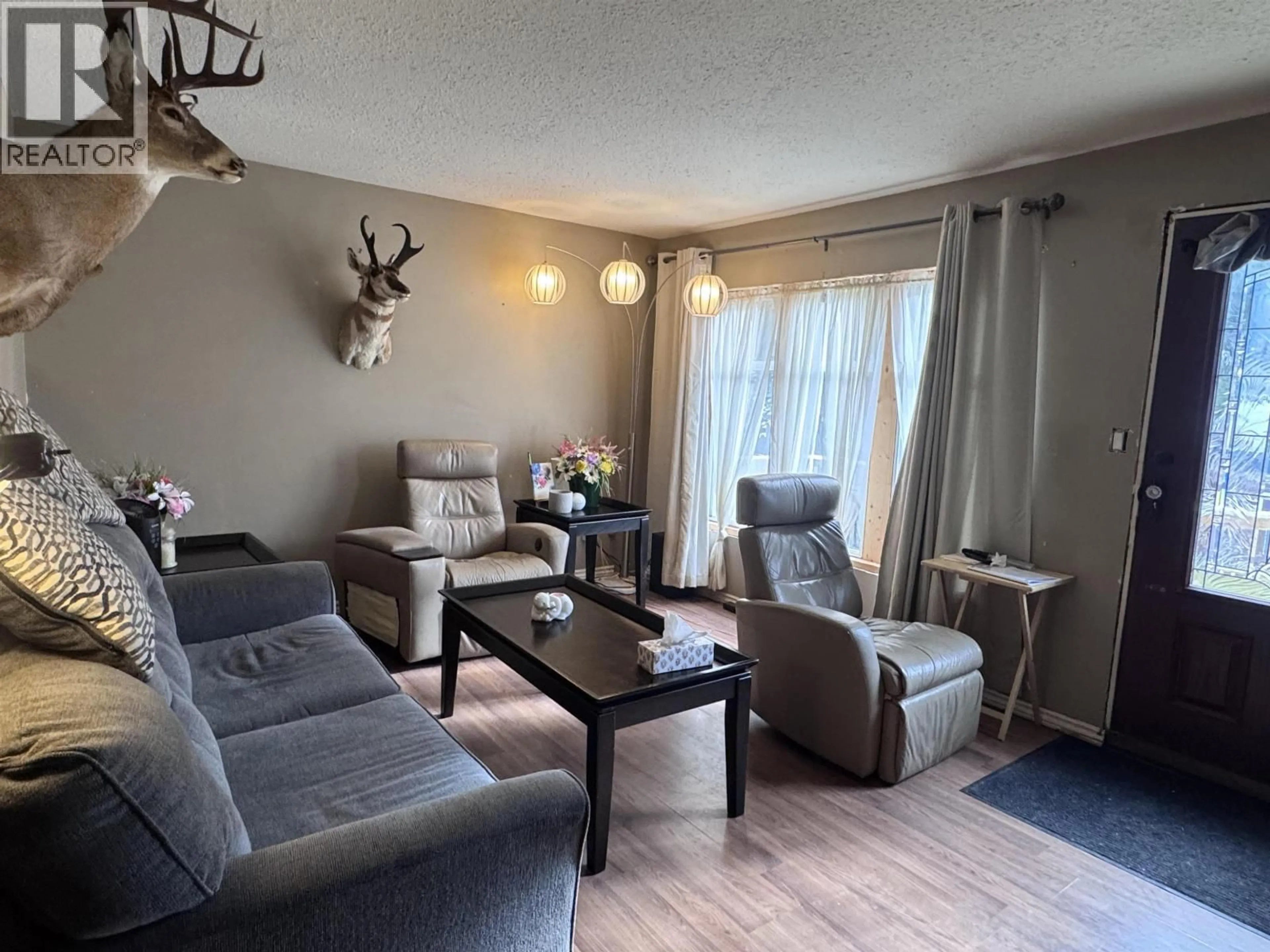 Living room with furniture, wood/laminate floor for 5030 AGAR AVENUE, Terrace British Columbia V8G1J1