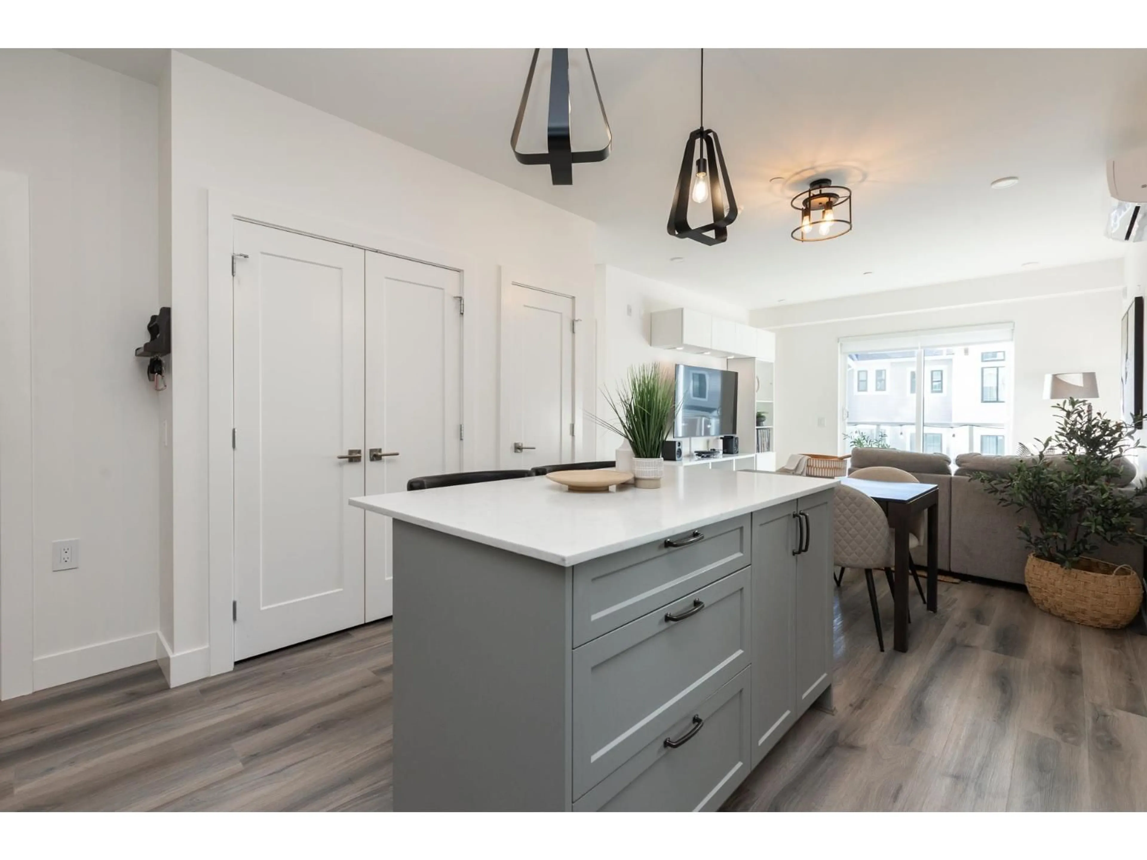 Open concept kitchen, wood/laminate floor for A216 - 8447 202 STREET, Langley British Columbia V2Y2B7