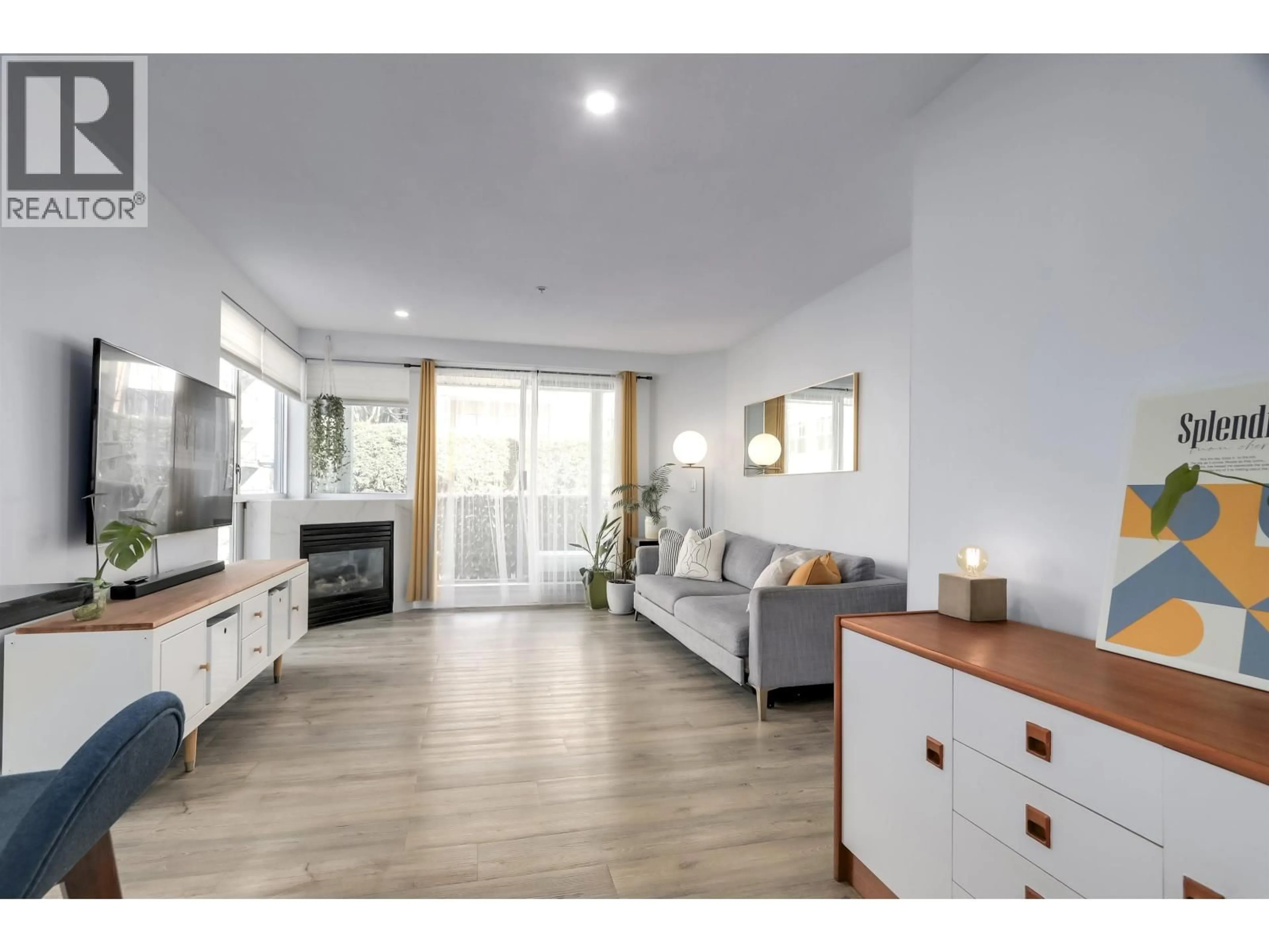 Living room with furniture, wood/laminate floor for 302 - 122 3RD STREET, North Vancouver British Columbia V7L1E6