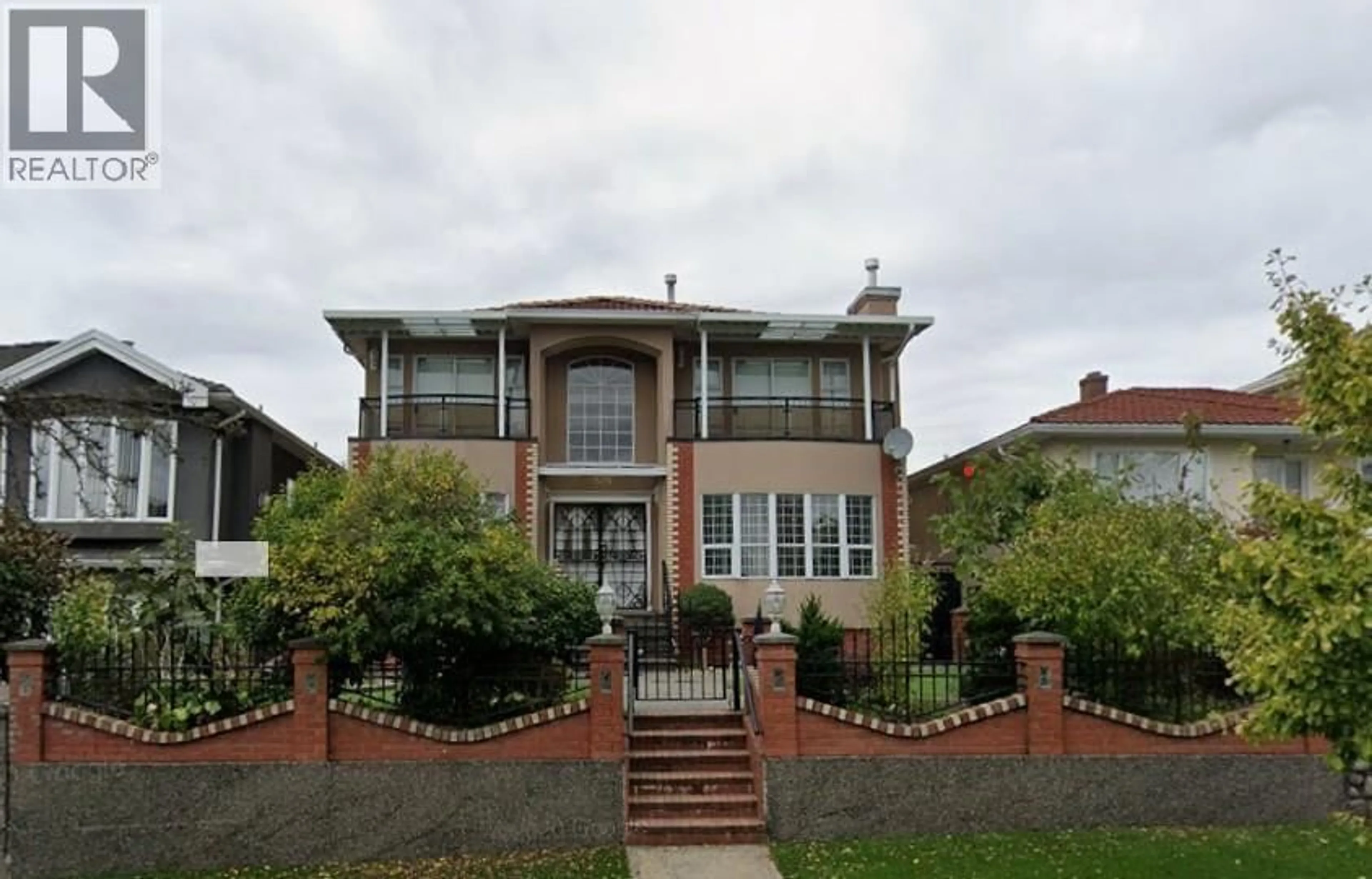 Home with brick exterior material, street for 6575 RALEIGH STREET, Vancouver British Columbia V5S2W9