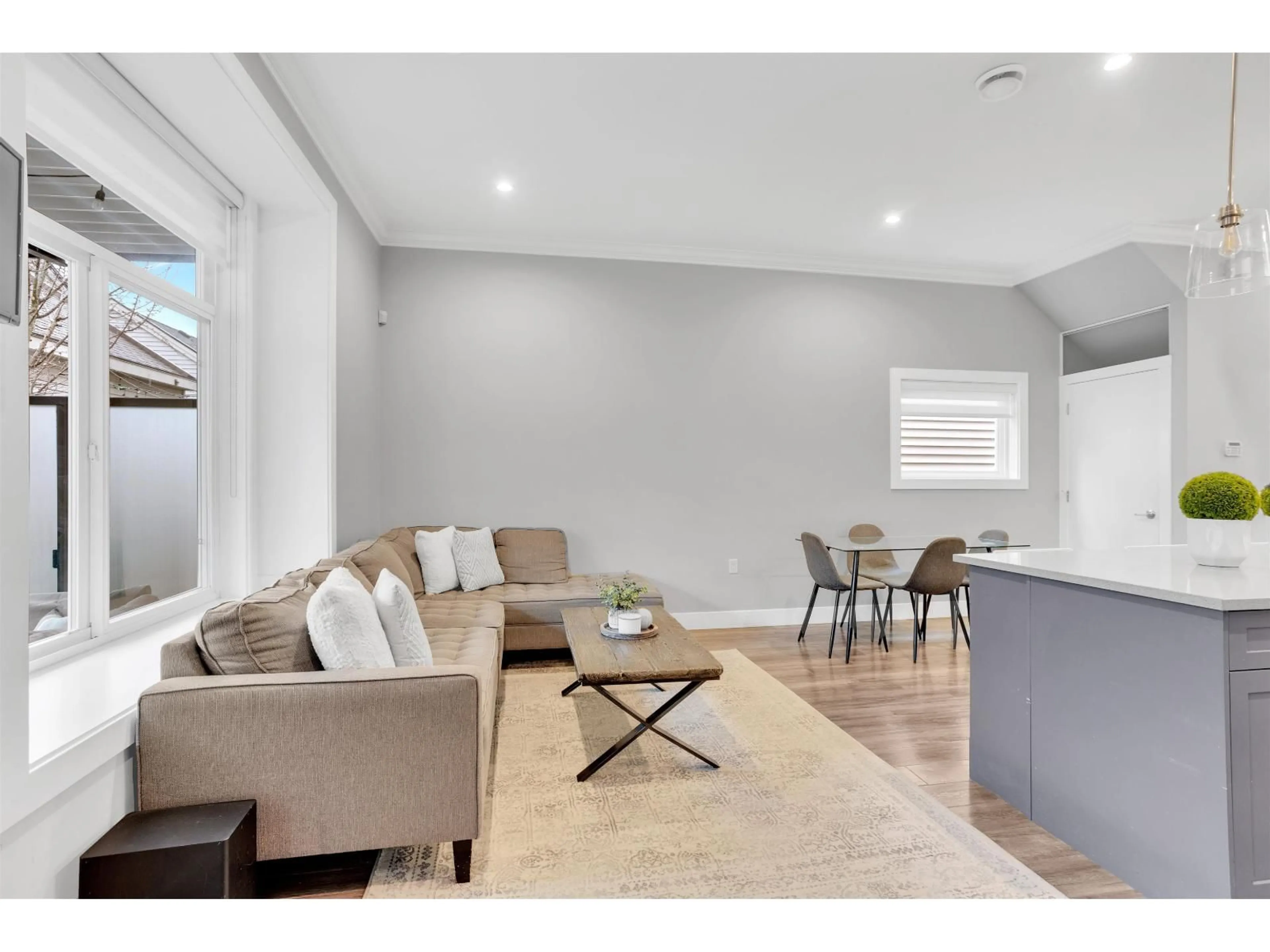 Living room with furniture, wood/laminate floor for 12991 59 AVENUE, Surrey British Columbia V3X0C4