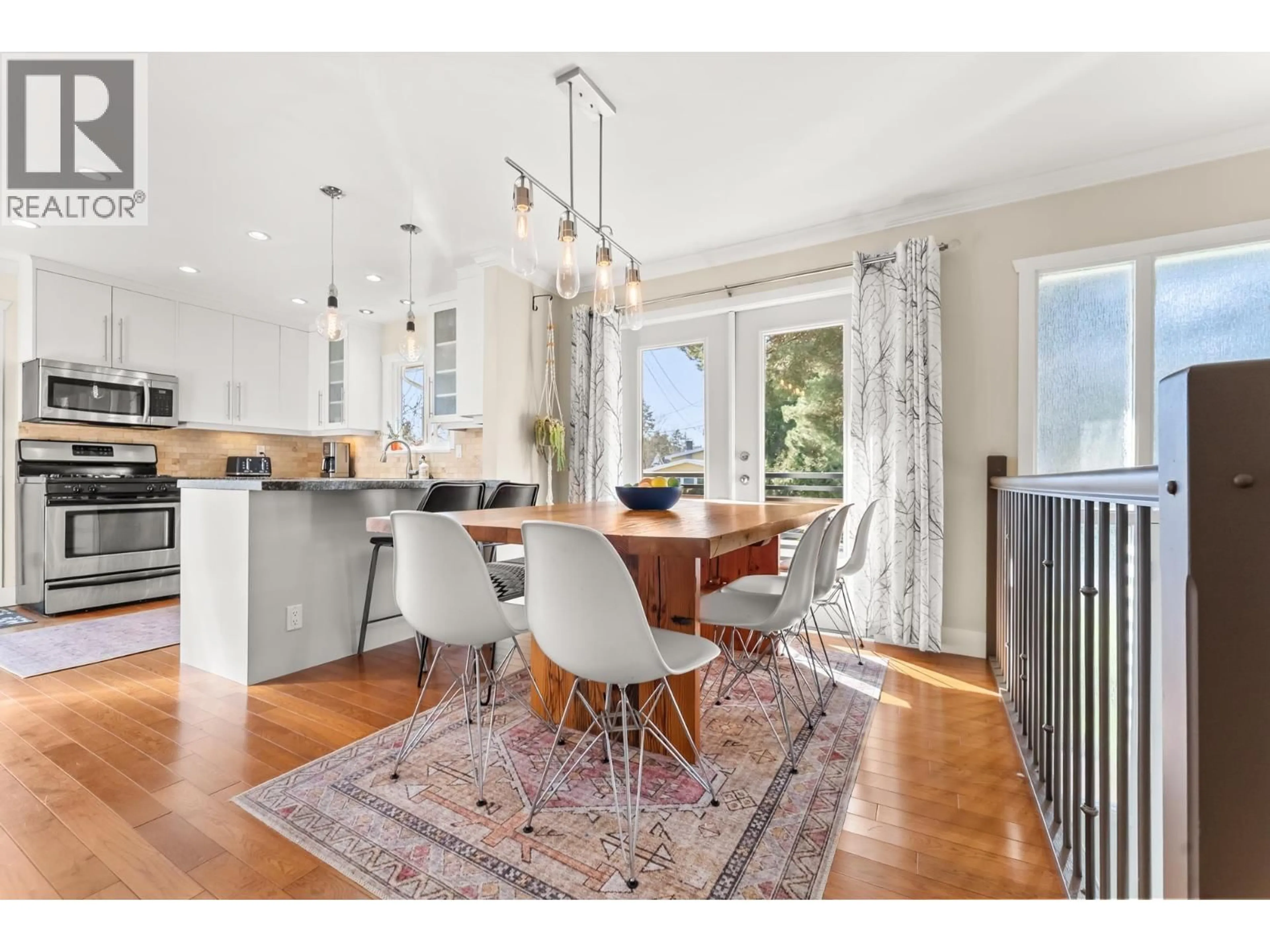 Open concept kitchen, wood/laminate floor for 1664 58 STREET, Delta British Columbia V4L1X7