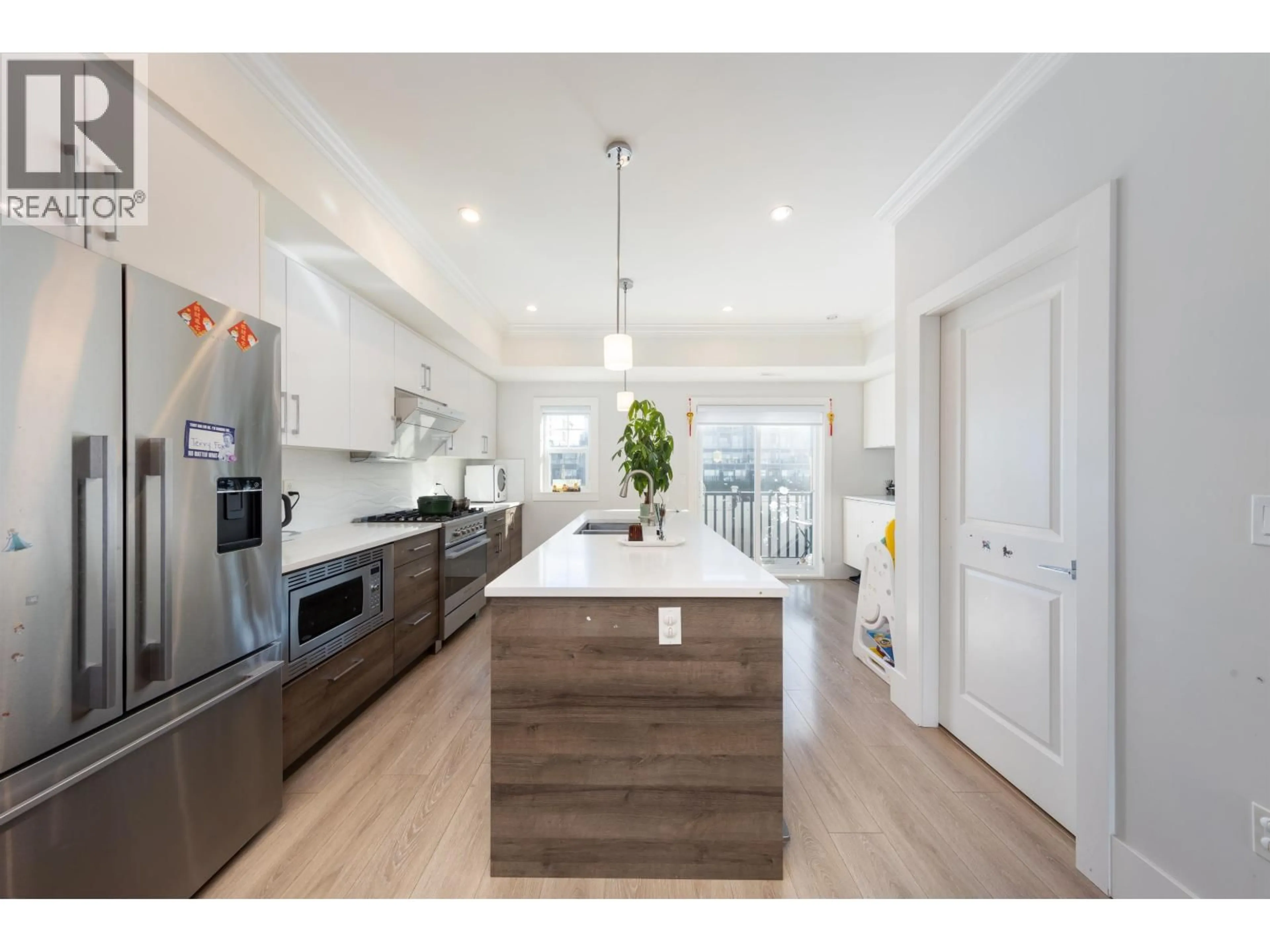 Open concept kitchen, wood/laminate floor for 9 - 9211 MCKIM WAY, Richmond British Columbia V6X0T1