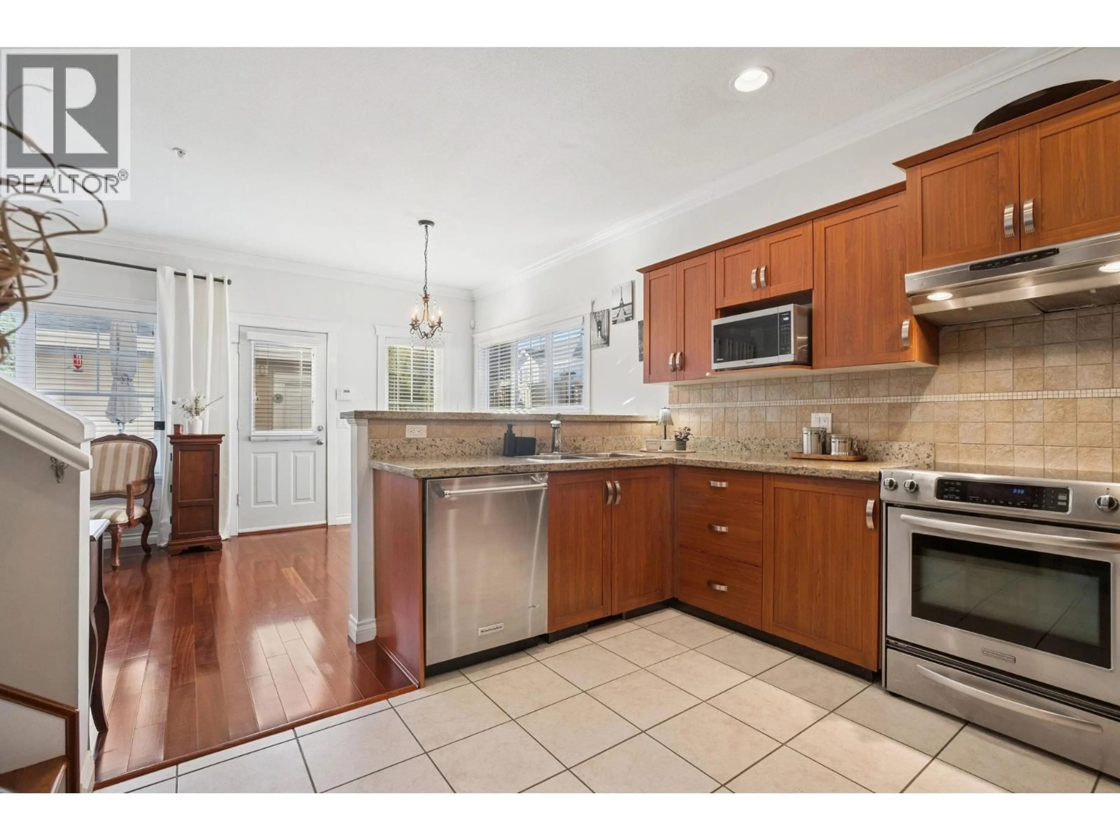 Open concept kitchen, ceramic/tile floor for 210 - 3000 RIVERBEND DRIVE, Coquitlam British Columbia V3C6R1