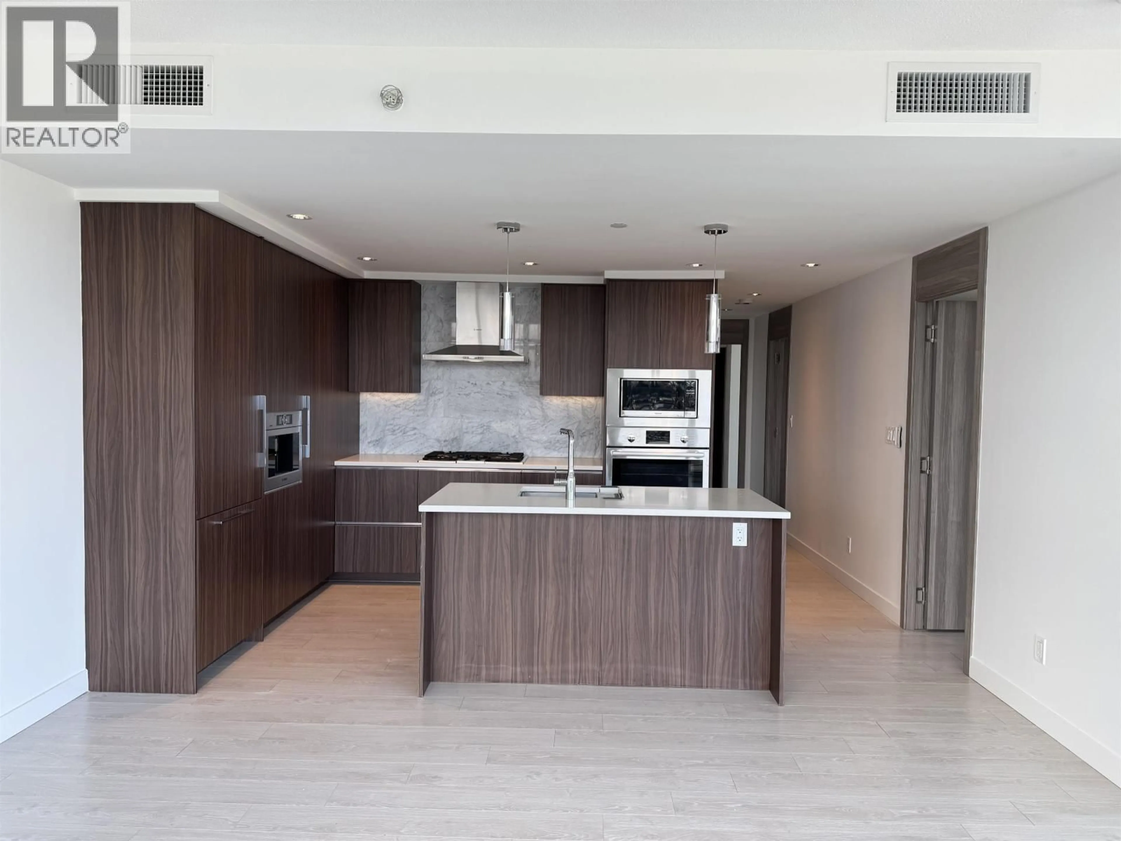 Open concept kitchen, wood/laminate floor for 3703 - 4720 LOUGHEED HIGHWAY, Burnaby British Columbia V5C0M8