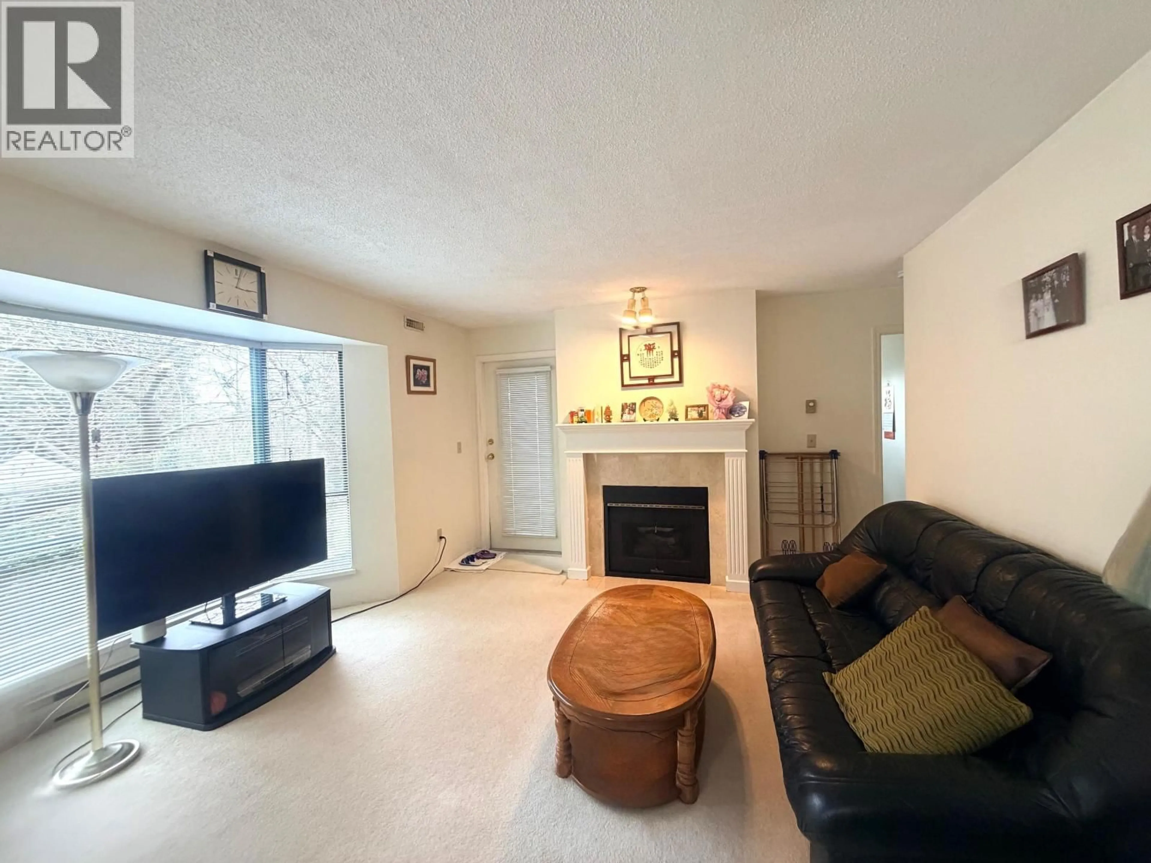 Living room with furniture, unknown for 203 - 5250 VICTORY STREET, Burnaby British Columbia V5J5H2