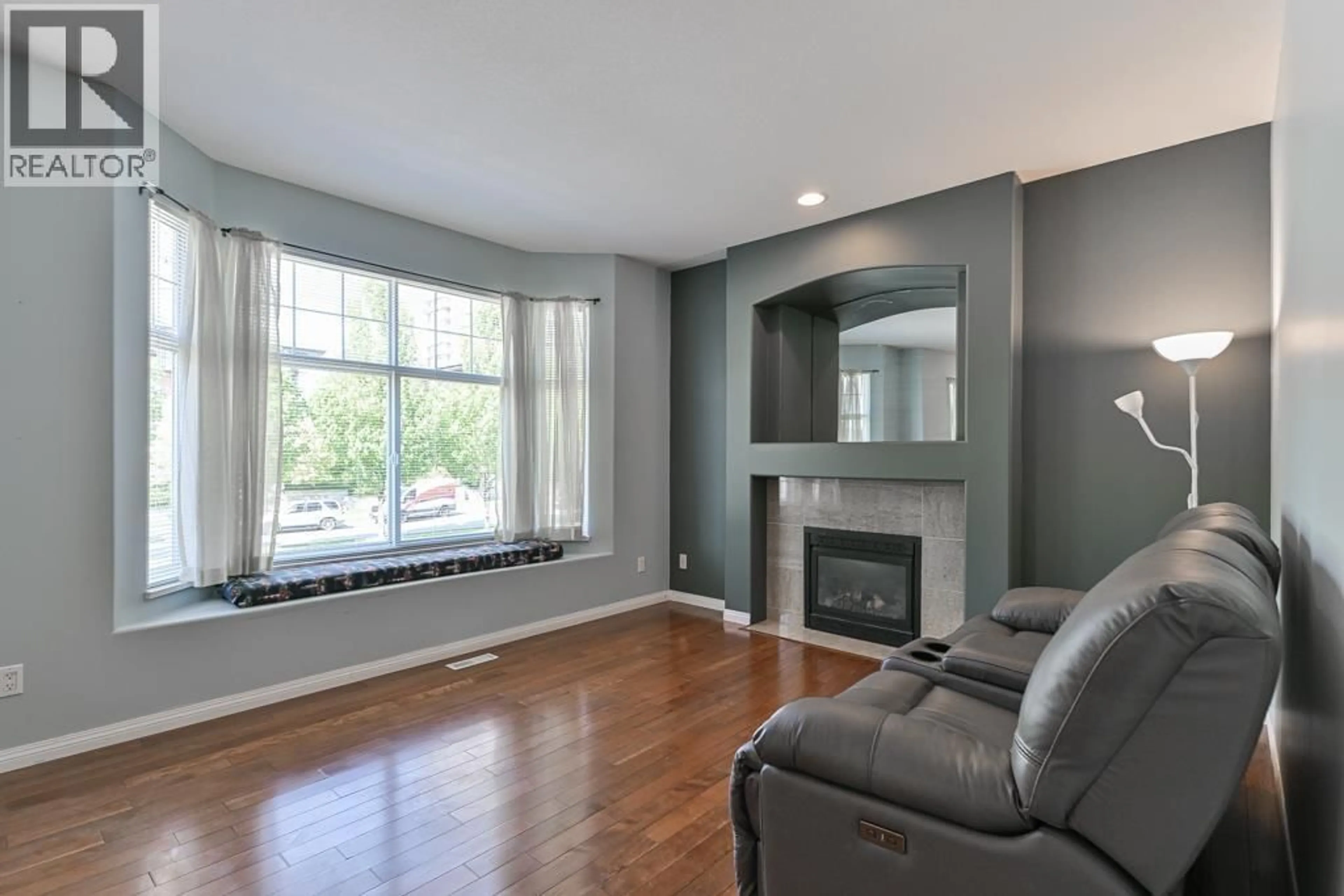 Living room with furniture, wood/laminate floor for 2672 LINCOLN AVENUE, Port Coquitlam British Columbia V3B8E5