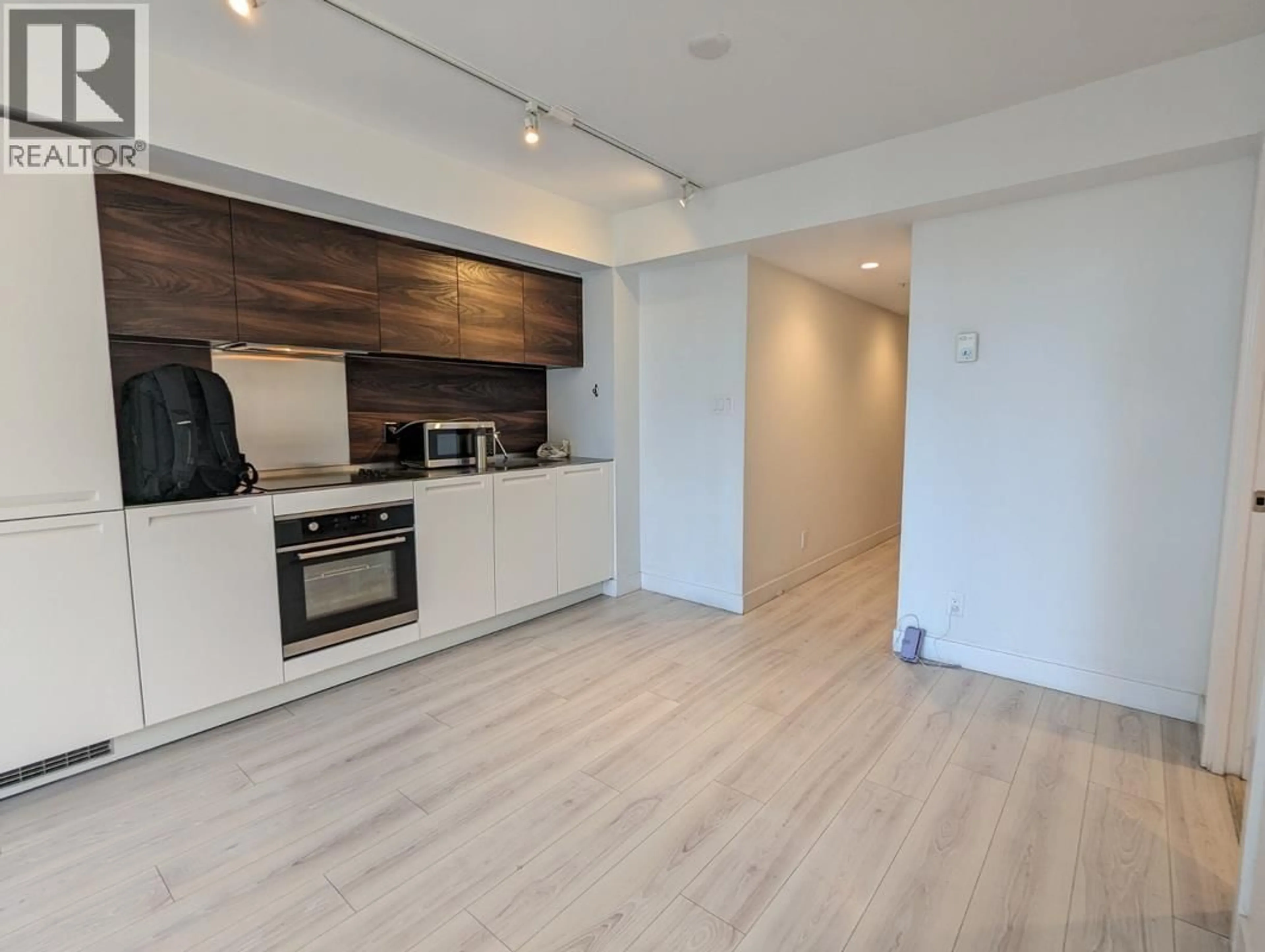 Open concept kitchen, wood/laminate floor for 1003 - 1133 HORNBY STREET, Vancouver British Columbia V6Z1W1