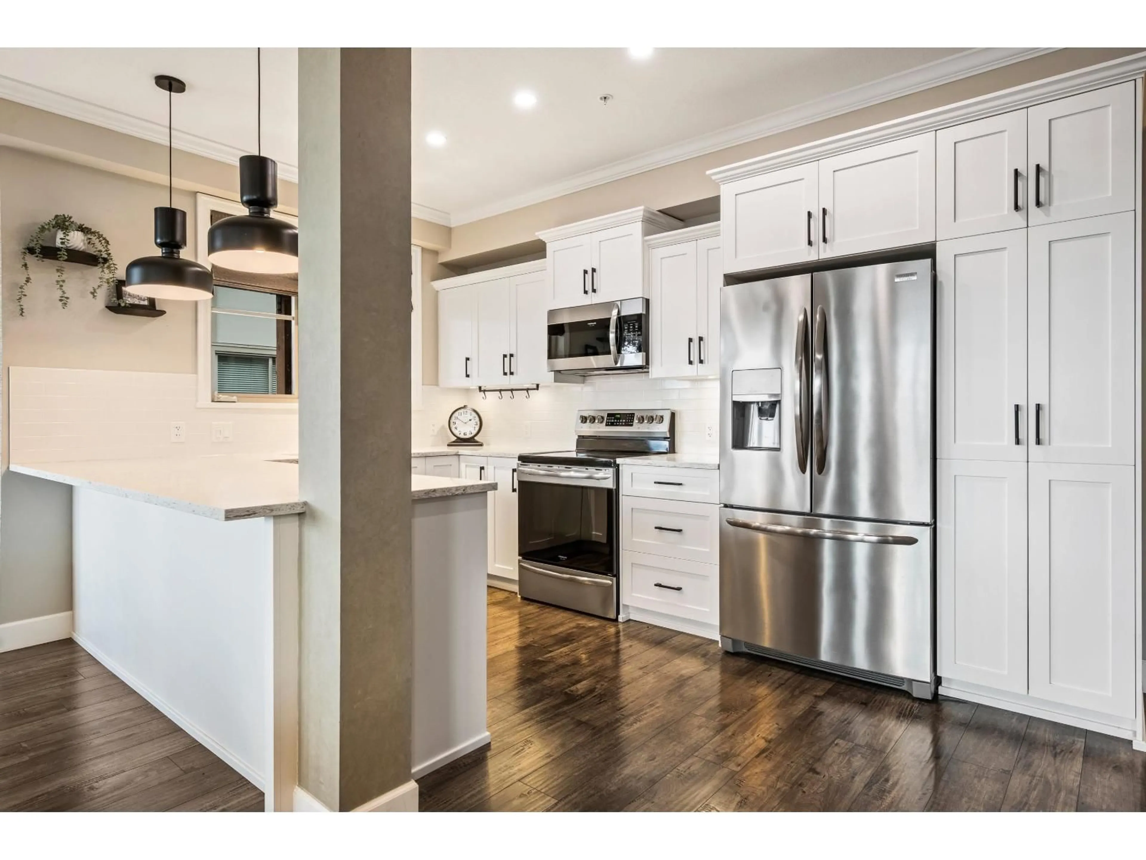 Open concept kitchen, wood/laminate floor for 210 - 45754 KEITH WILSON ROAD, Chilliwack British Columbia V2R6A9