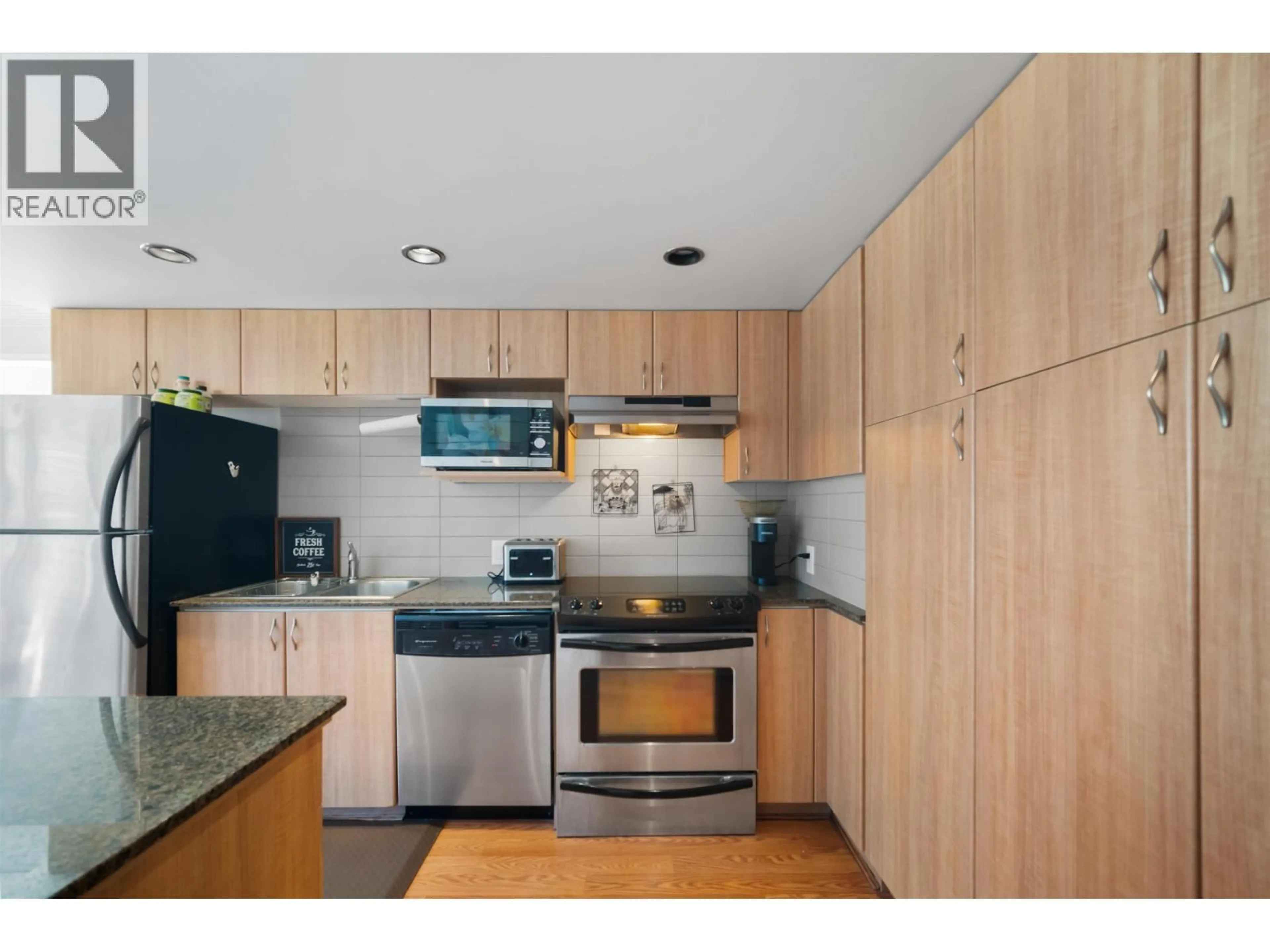 Standard kitchen, wood/laminate floor for 409 - 9232 UNIVERSITY CRESCENT, Burnaby British Columbia V5A0A3