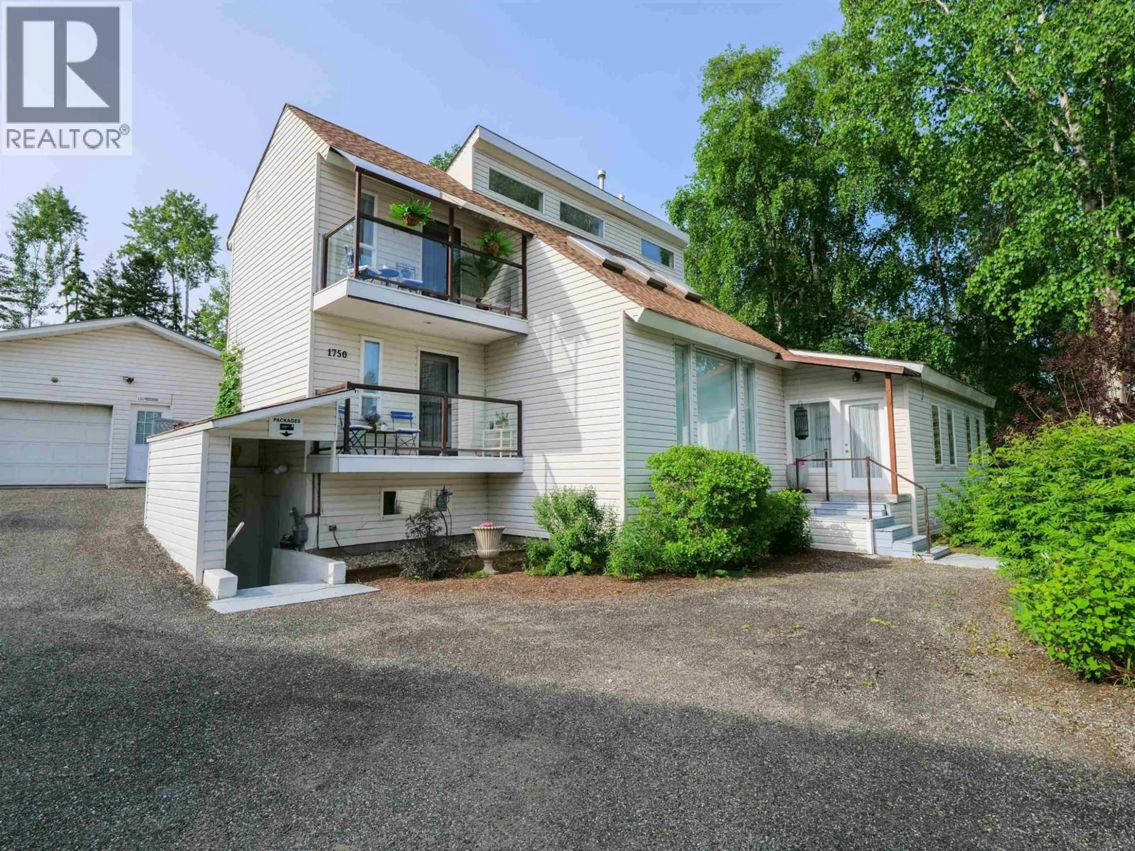 A pic from outside/outdoor area/front of a property/back of a property/a pic from drone, street for 1750 BEACH CRESCENT, Quesnel British Columbia V2J4J6